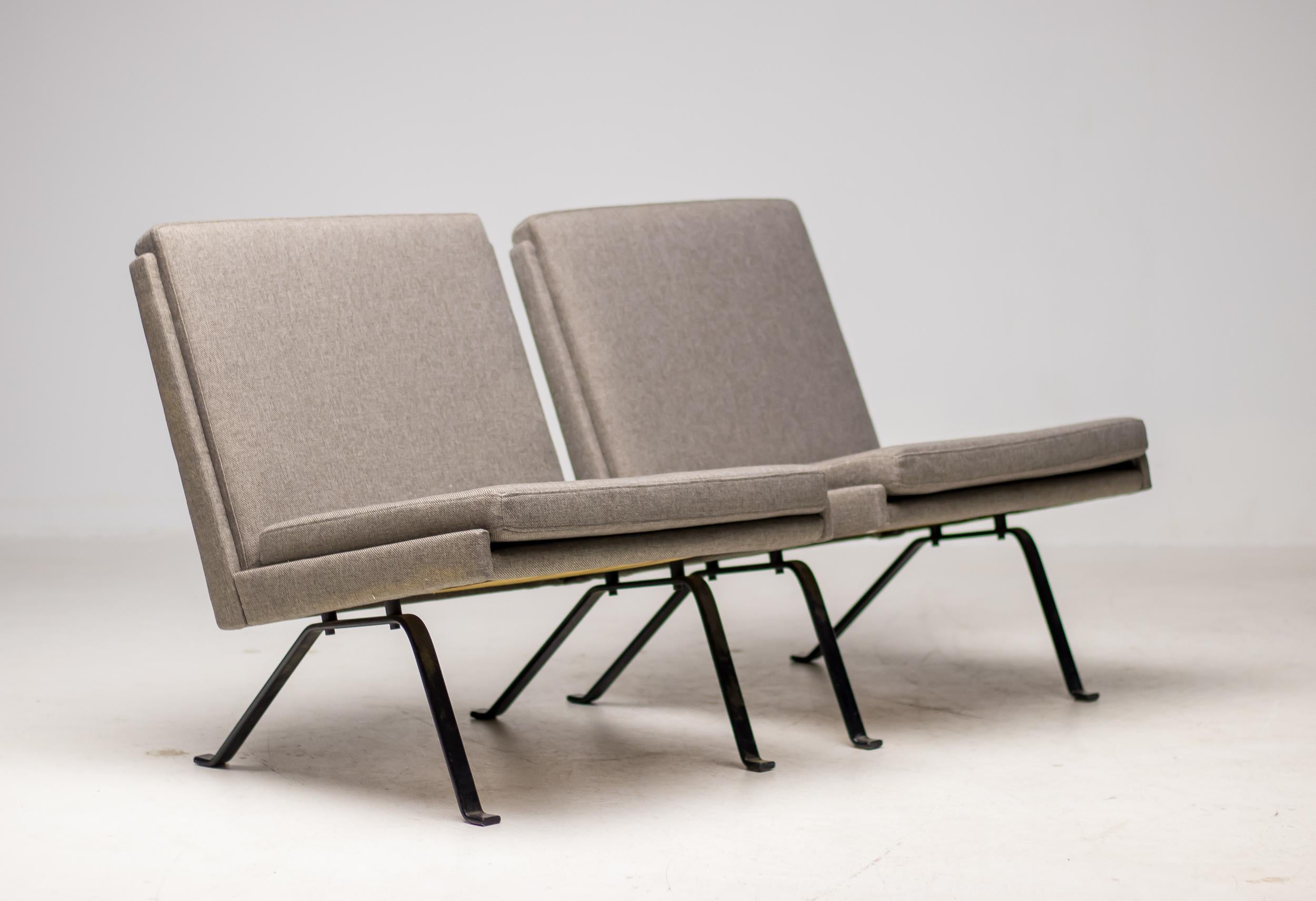 A striking pair of minimalistic lounge chairs crafted in the Netherlands around 1960. These exceptional chairs embody the clarity and discipline of mid-century Dutch design, with a strong architectural presence reminiscent of the work of Gerrit