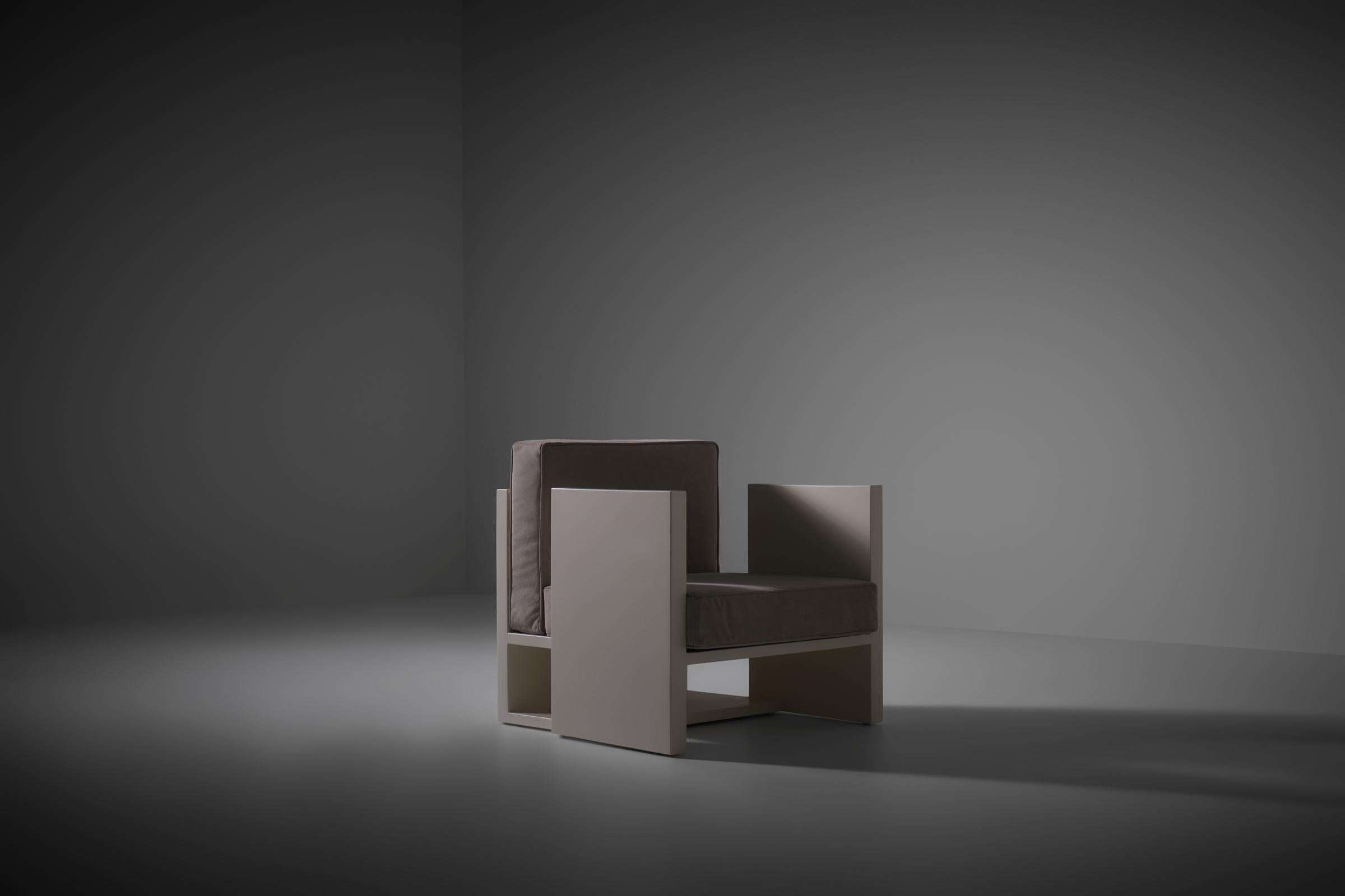 Architectural Dutch Modernist chair, 1950s. Influenced by the Dutch 'De Stijl' movement, it features a sleek, cubistic design. Created by a Dutch architect, the modernist chair is crafted from plastered and lacquered traditional wooden boards. Its