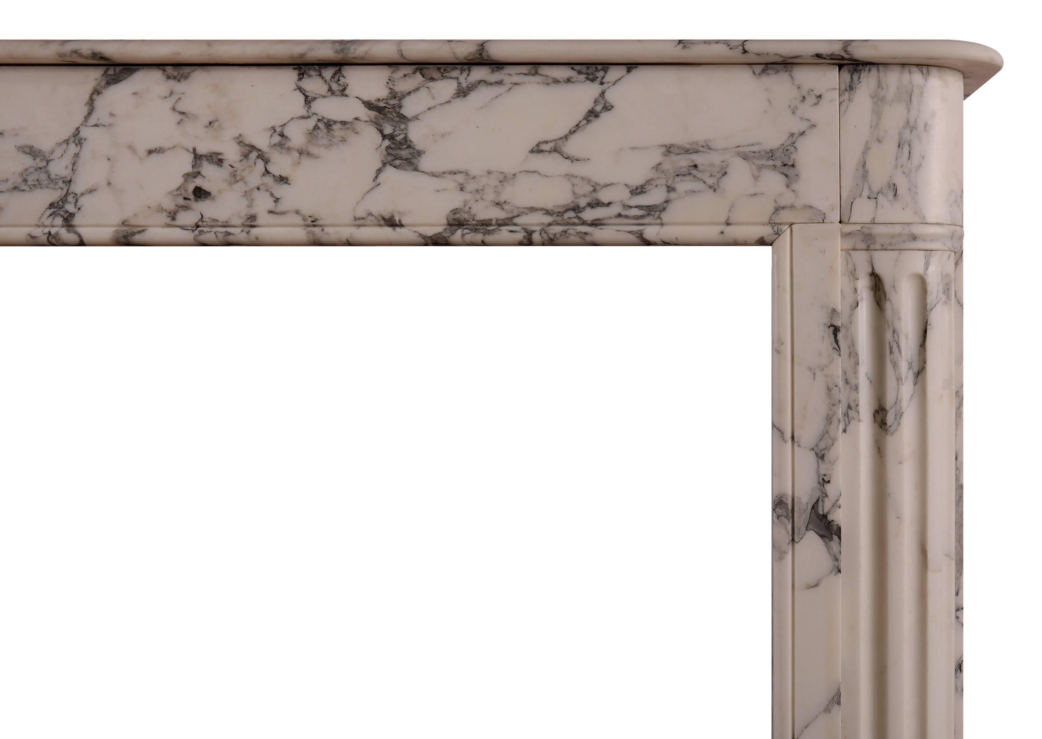 A good quality French fireplace in veined Italian Arabescato marble. The jambs with shaped pilasters and stop-flutes to base. The plain frieze surmounted by shaped moulded shelf, 19th century.

Measures: 
Shelf width: 1290 mm / 50 3/4 in
Overall