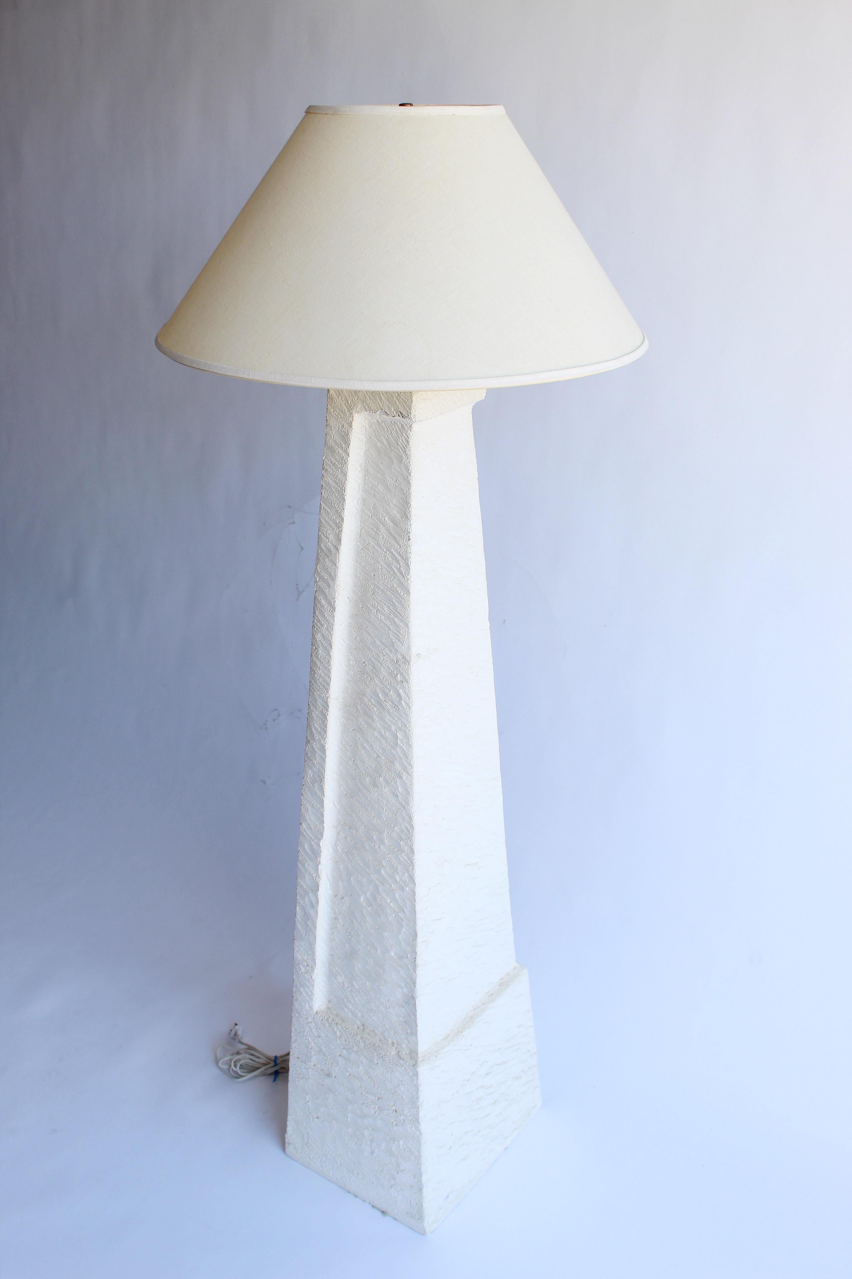 This stunning floor lamp is reminiscent of Michael Taylor modernist design and some of Jean Michel Frank plaster, cement designs but this unique lamp is heavier and has an organic feel. It has all original vintage wiring and brass fitting. Lamp is