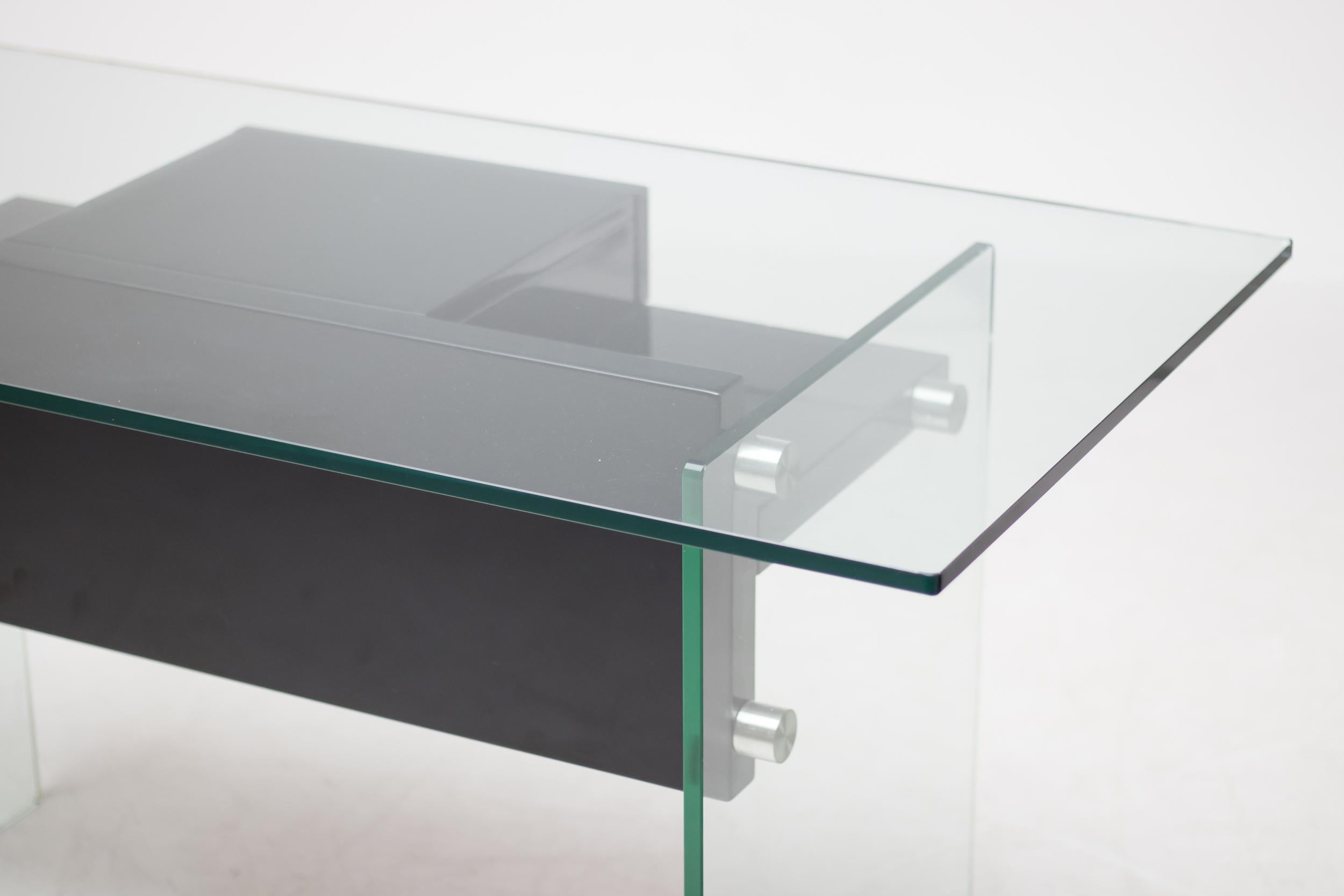 Stainless steel, Japanese gloss lacquered wood and glass desk, Xavier Marbeau designed similar desks in the 1970s.
This elegant design is stripped to the bare essentials; a workspace and a drawer.
What more could you actually really need these