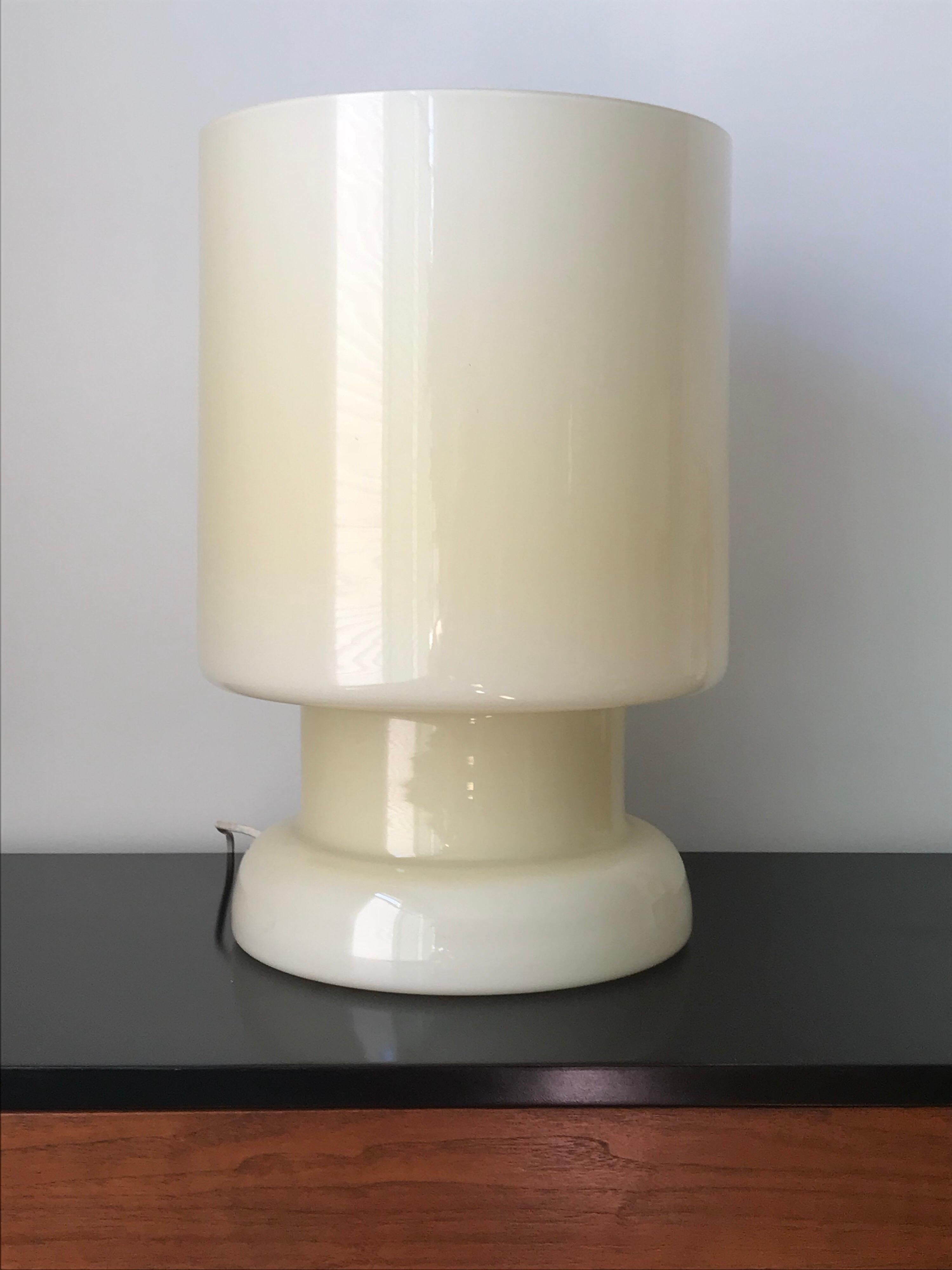 A nice architectural form with a great scale. 
Made of handblown glass with porcelain light socket and original wiring.
No chips or damage.
It has patina consistent with age.
Great to use anywhere, for example in a hall on a console or in a