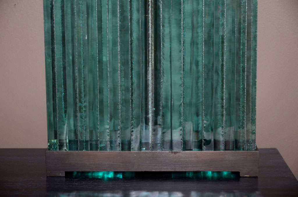 Rectangular solid glass lamps are set within a bronze finish brass frame after Jean Michel Frank design. Double socketed, with pull chains and bronze finish finial.
The lamps can be custom ordered in the metal finish of your choice, nickel, brass,
