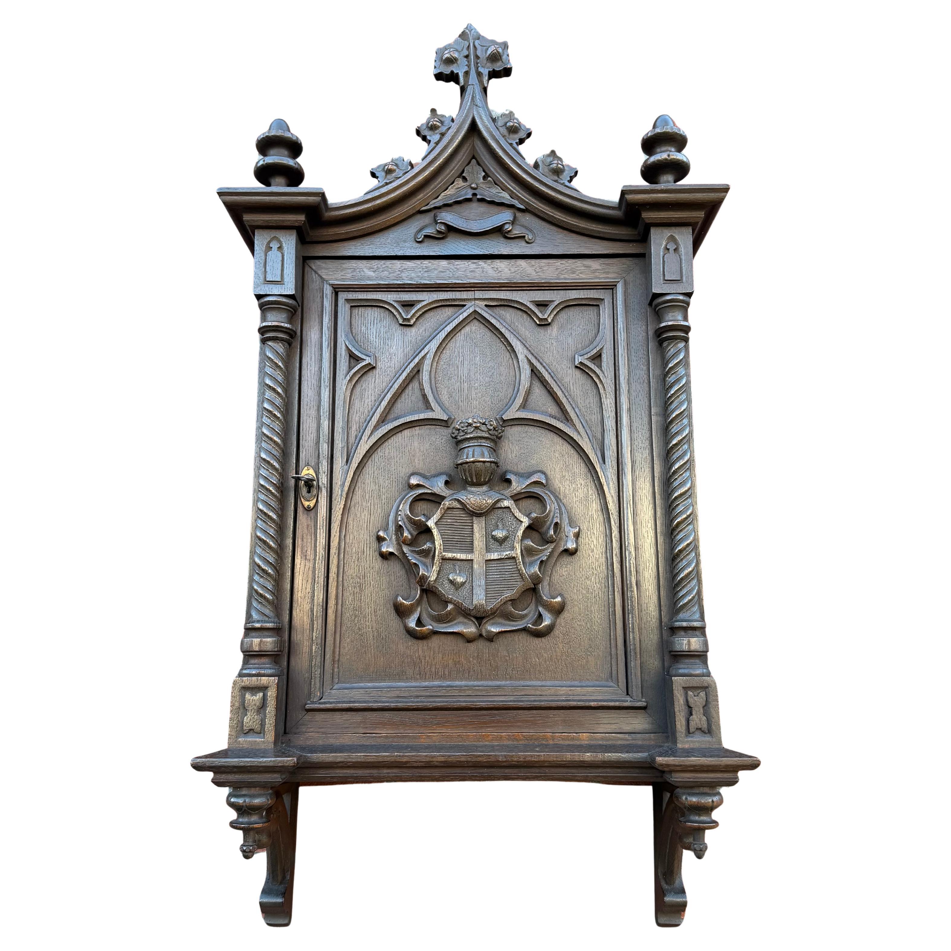 Architectural Gothic Revival Oak Wall Cabinet with Heraldic Carving For Sale