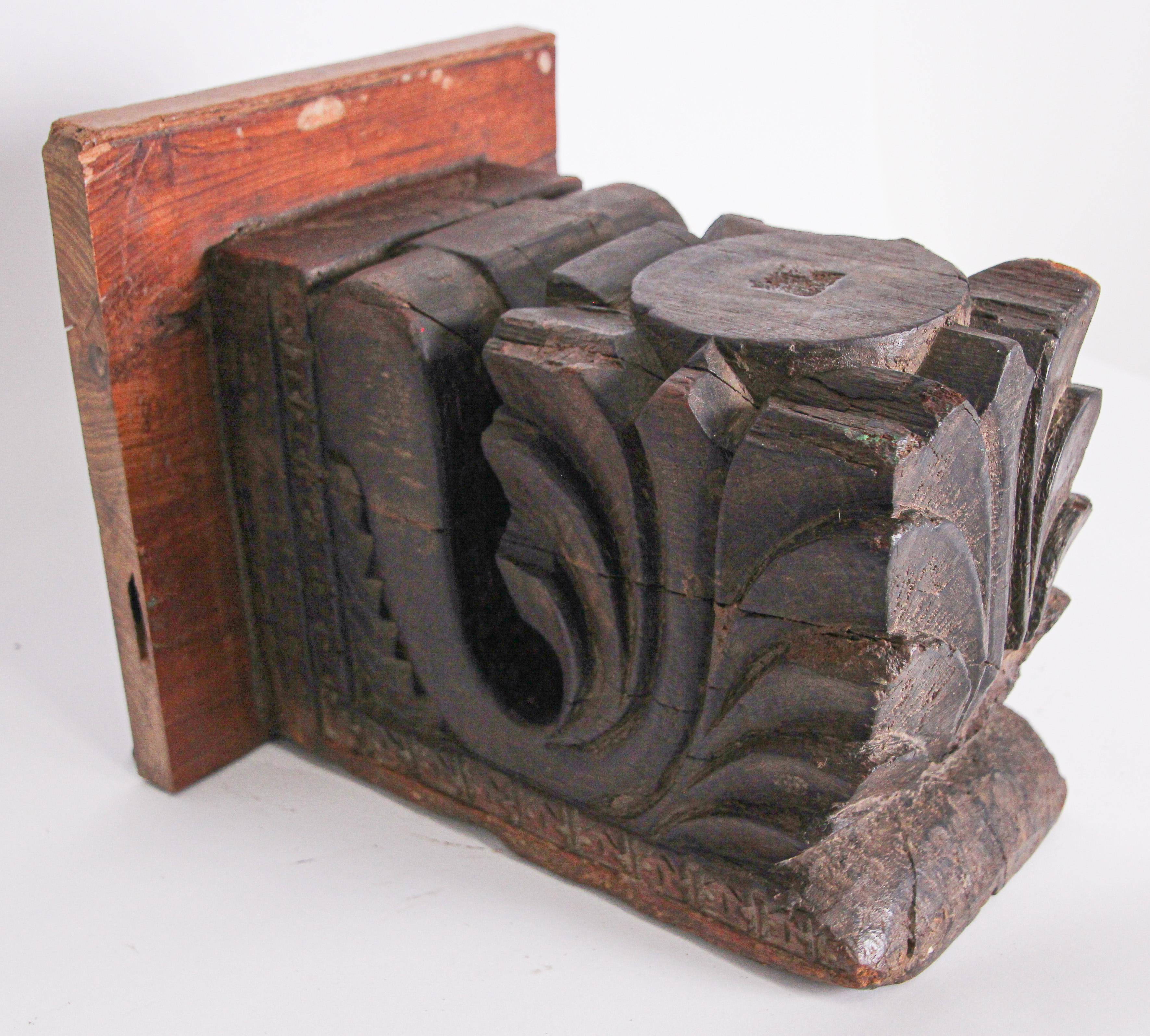Antique architectural carved wood temple fragment from Rajasthan, India.
 
Made into a wall bracket stand.
 
19th century Hindu temple fragment. This antique fragment were elements of a section of hand carved wood frieze, within a temple in India.