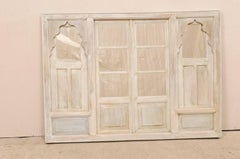 Architectural Indian Wall Decoration Adorned with Scalloped Arches and Mirrors