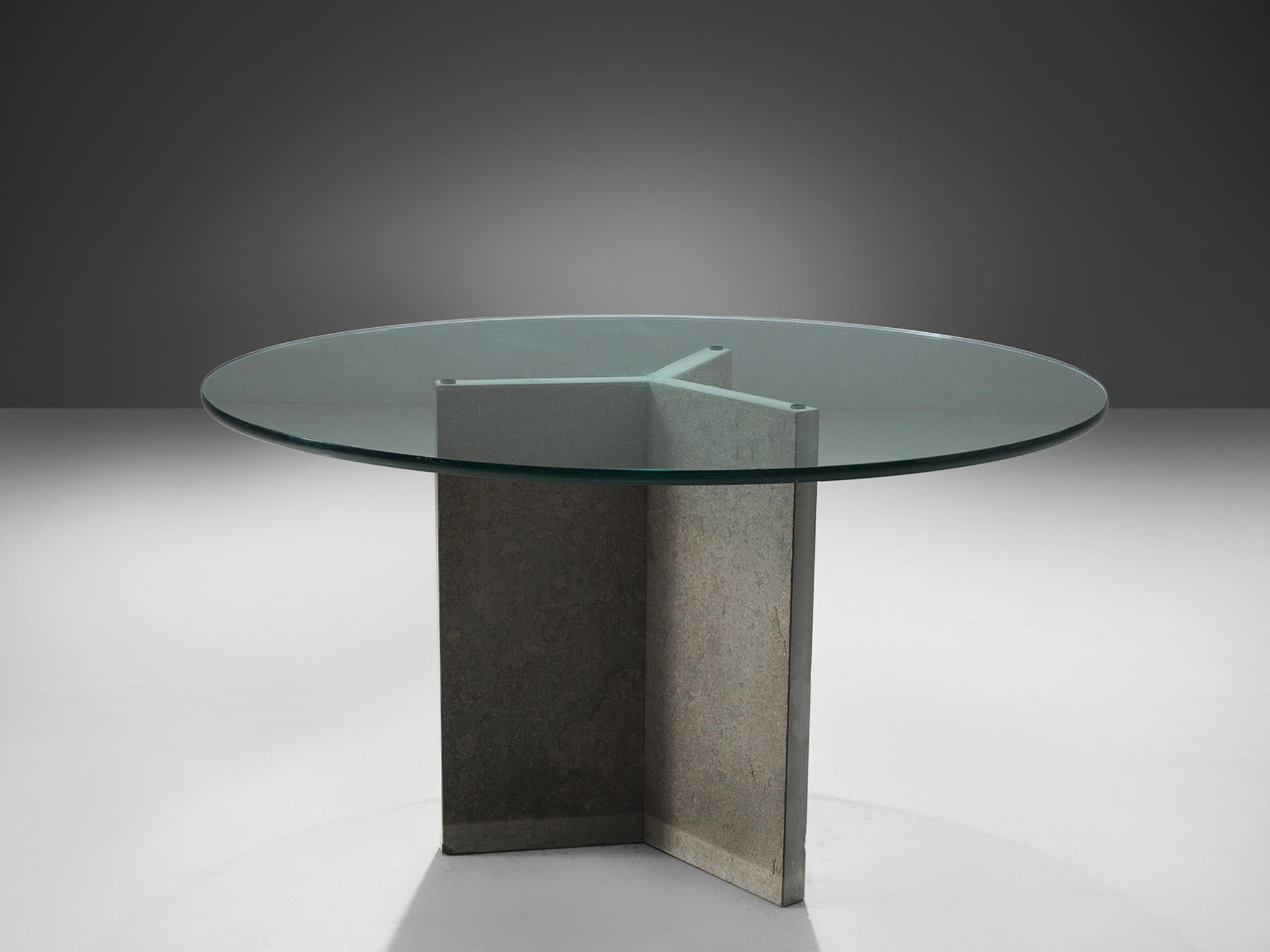 Dining table, stone, glass, Italy, 1970s 

This stone and glass centre table is exemplary for the postmodern design of the postwar Italian era. This stone pedestal table has a architectural stone tripod foot. Thanks to the round top made of glass