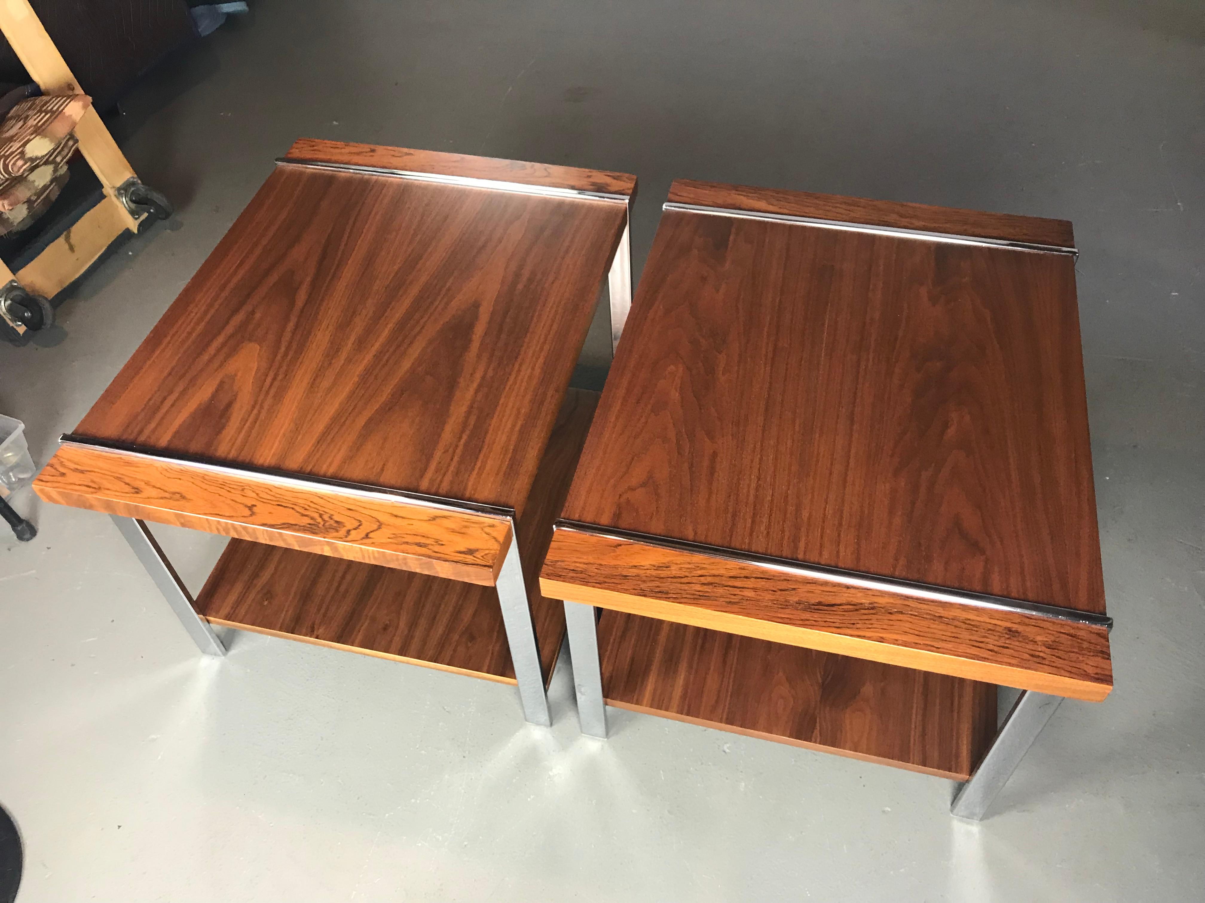 Very nice pair of Mid-Century Modern end tables by Lane. Made of rosewood, walnut & chrome. The tables have been refinished. Very light signs of use on the chrome. Nice chrome frames that show the wood planks jutting through. 

28 x 22 x 20