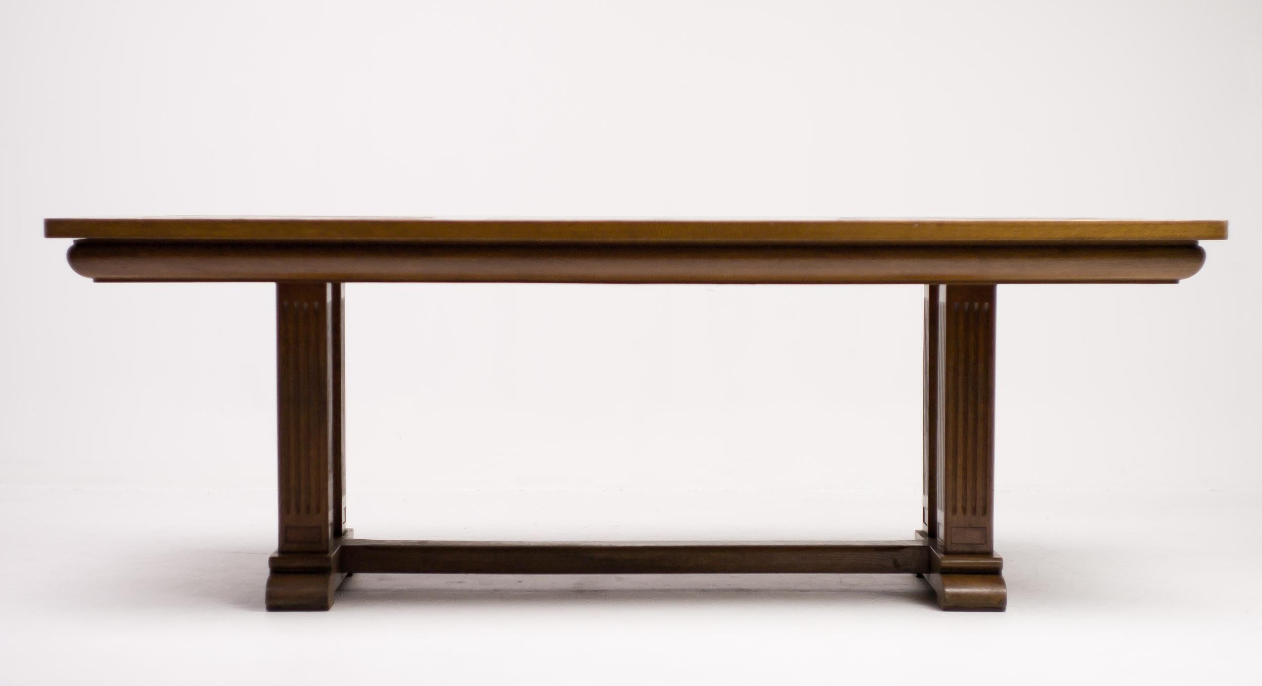 Monumental dining table made circa 1920 in solid oak with rectangular inlays in the top of dark wood, most likely wengé.
A classic combination of materials used in Amsterdam school designs.
Impressive table in a very useable size.

  