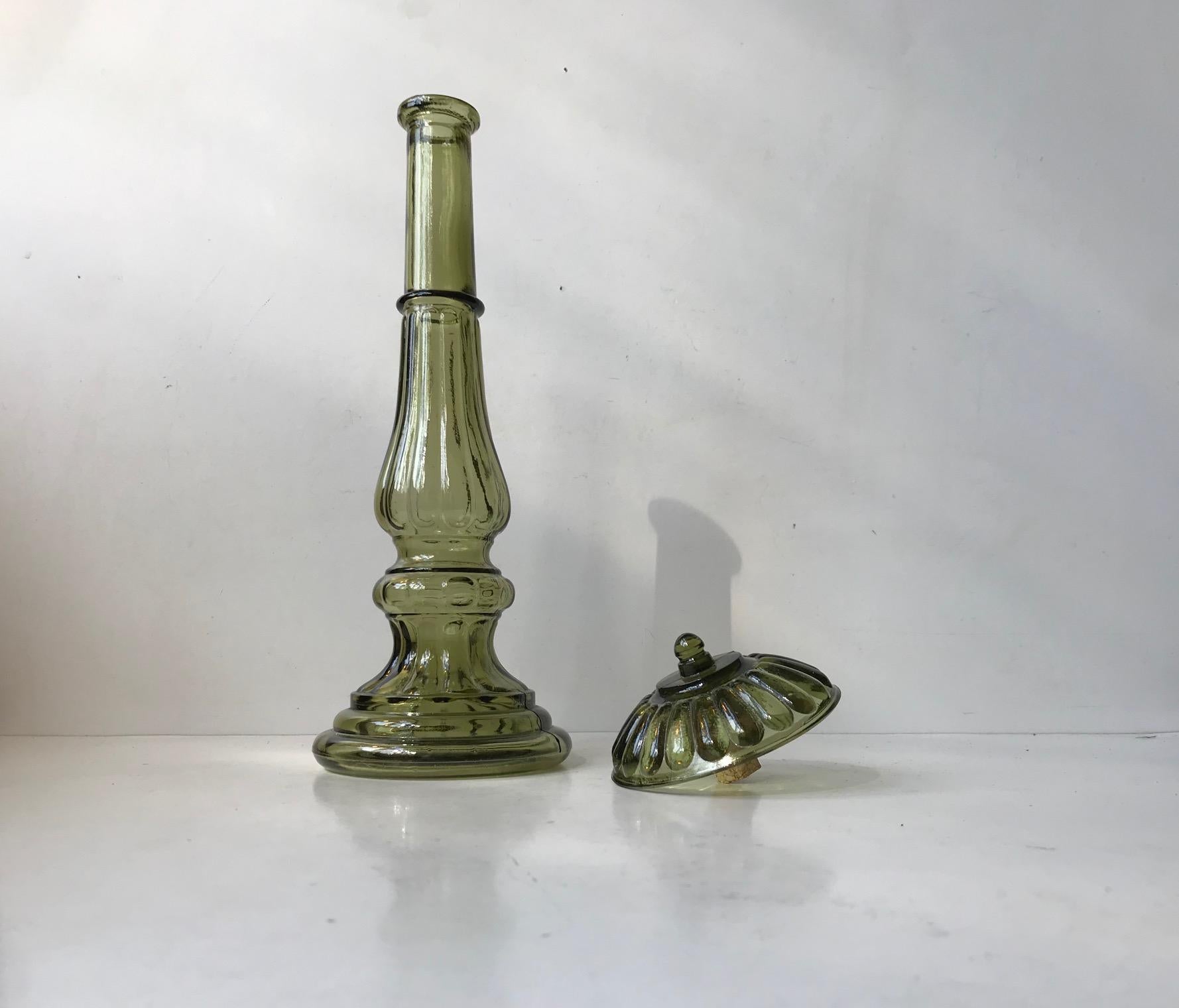 Architecturally shaped olive green glass decater. Designed and manufactured by Empoli in Italy during the early 1970s. Capacity 0.6-0.7 liters. It is marked Made in Italy to its base. Measurements: H: 34 cm, D: 10 cm.