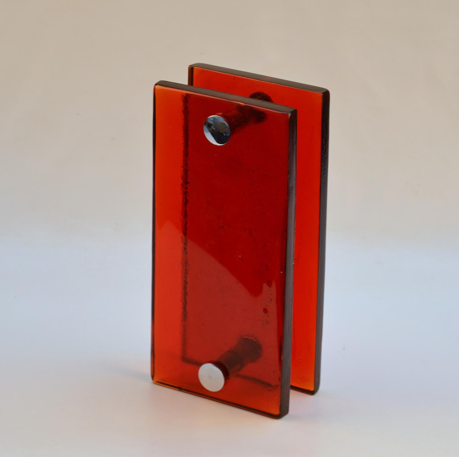 A pair of double door handles, push and pull, rectangular vibrant red cast glass with chrome fittings designed for a glass or wooden doors but suitable for any kind of doors. The glass slabs are cast by directing molten glass into a mould where it