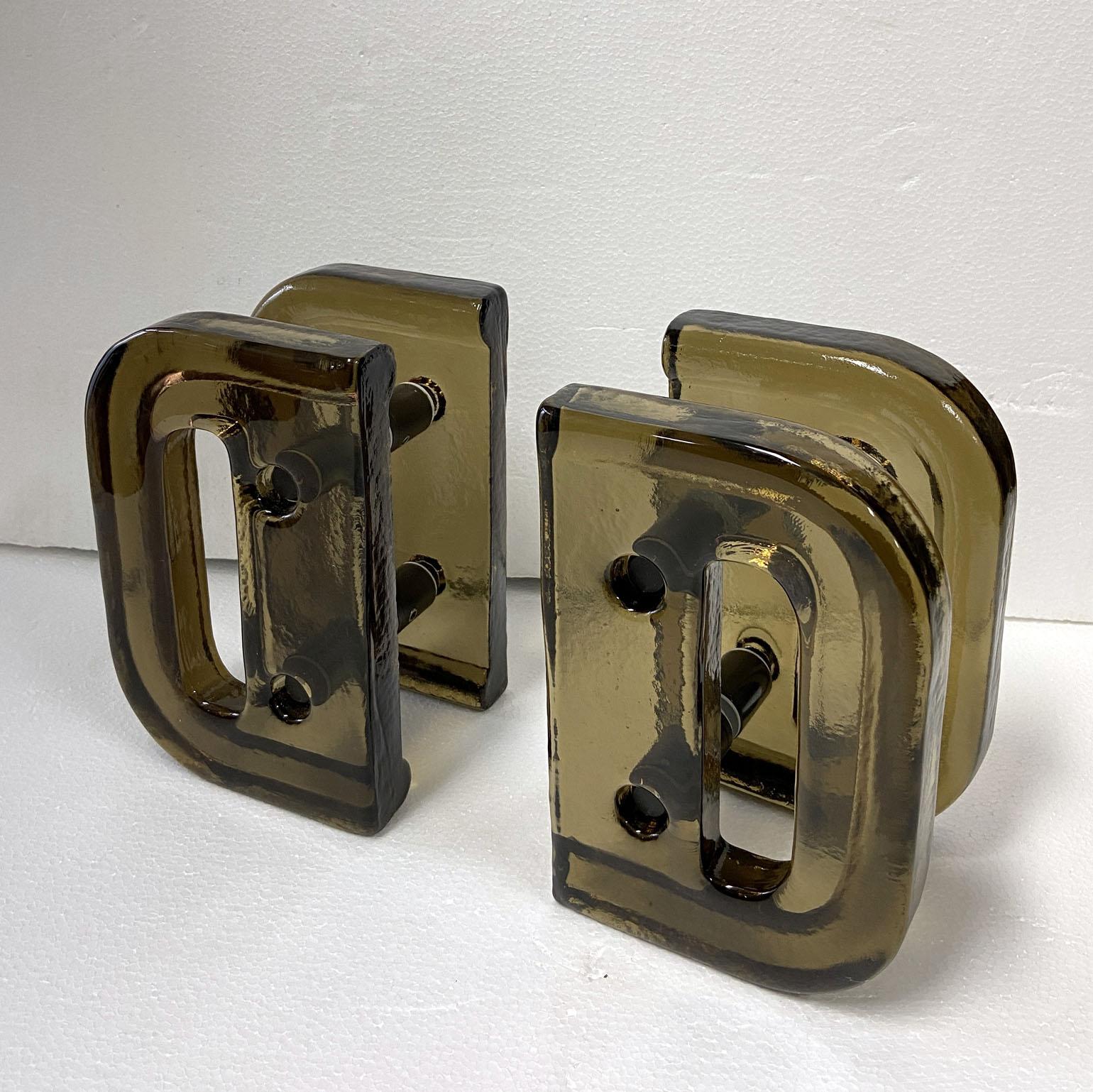 A pair of double door handles, push and pull, rectangular vibrant red cast glass with chrome fittings designed for a glass or wooden doors but suitable for any kind of doors. The glass slabs are cast by directing molten glass into a mould where it