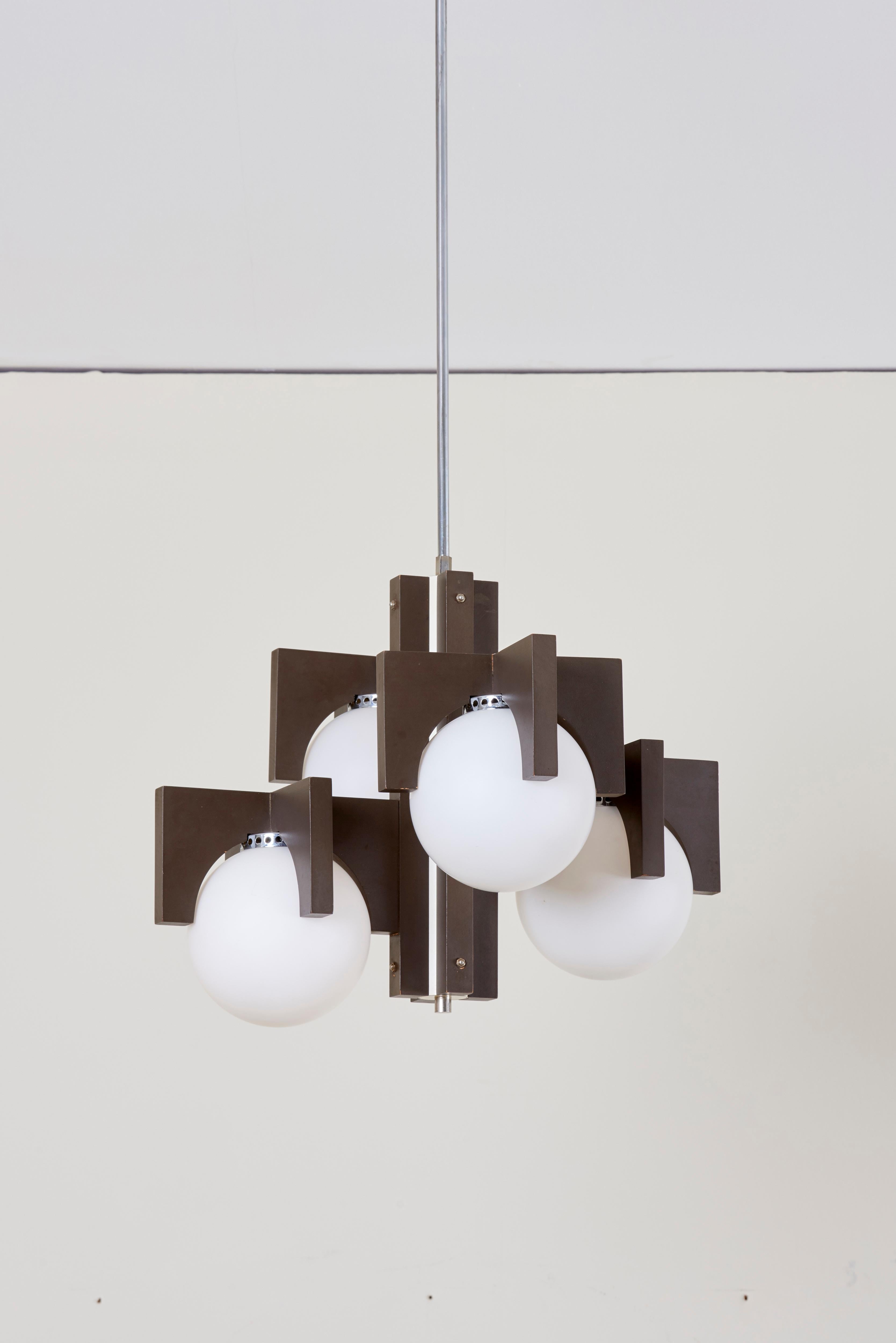 Architectural pendant lamp or chandelier in wood and metal.
4 x E14 bulbs.

To be on the safe side, the lamp should be checked locally by a specialist concerning local requirements.