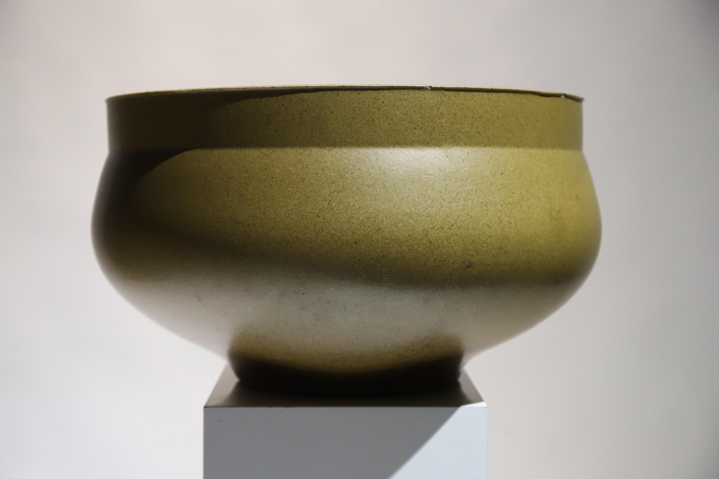 A large David Cressey glazed pot or vessel is a stunning work of art that combines form, texture, and color in a captivating way. Known for his ceramic creations, David Cressey has a distinct style that is both modern and organic.

This particular