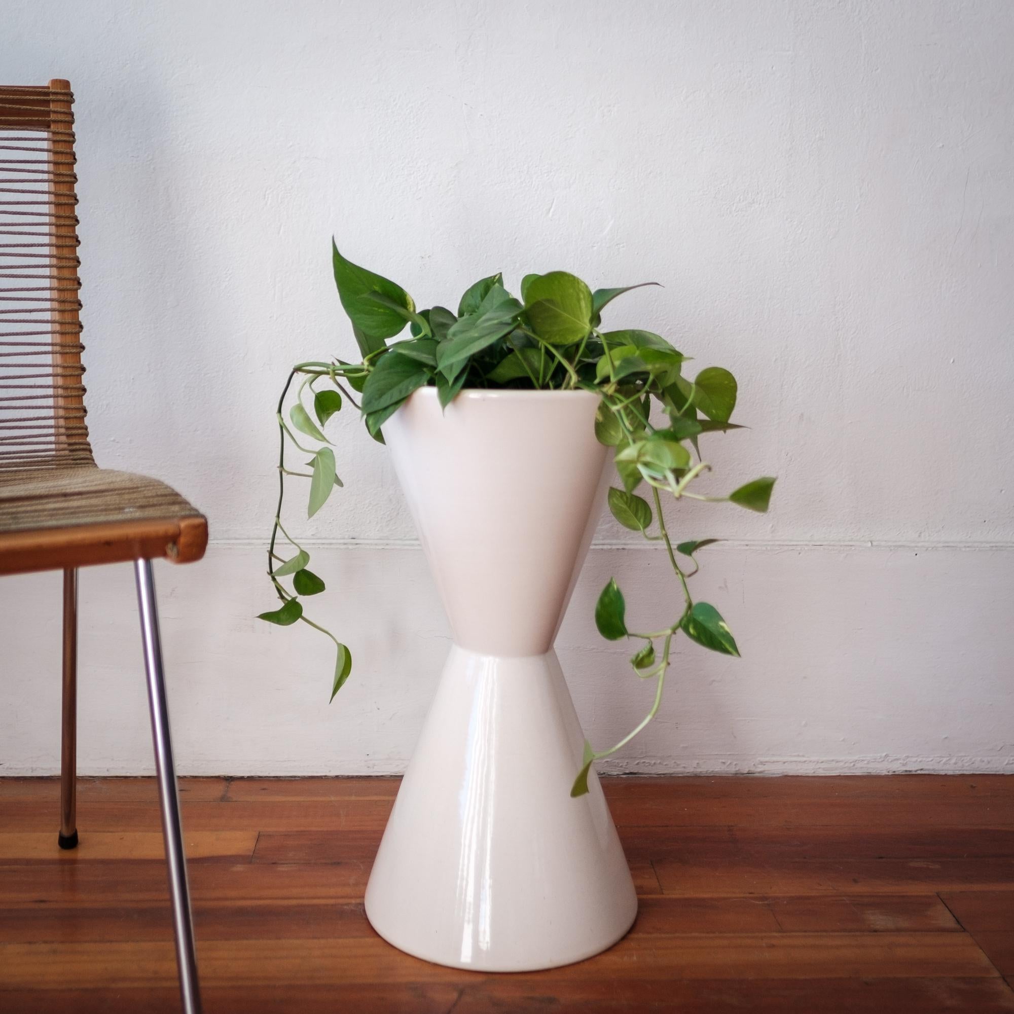Architectural Pottery double cone planter by Lagardo Tackett. White glaze. Not drilled so it would work great indoors or outside. Architectural Pottery is the epitome of California Mid-Century Modern design.