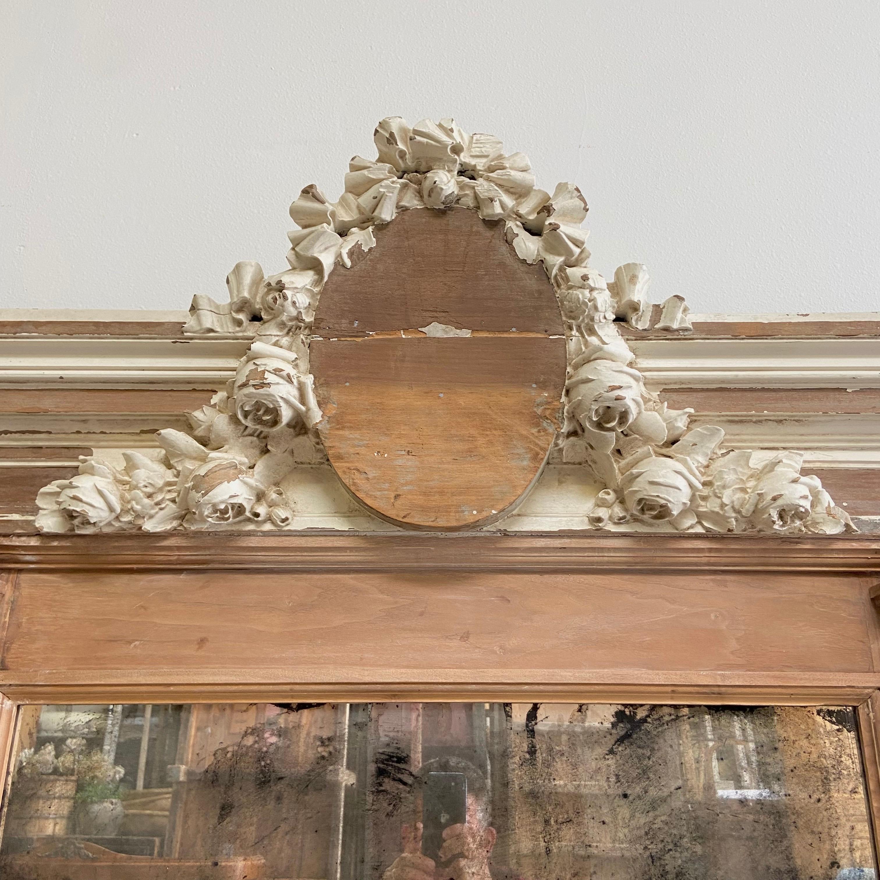 Rose carved mirror 51-1/2” W x 60” H x 7” D
Mirror: 29” W x 32” H
Made from an antique architectural header.