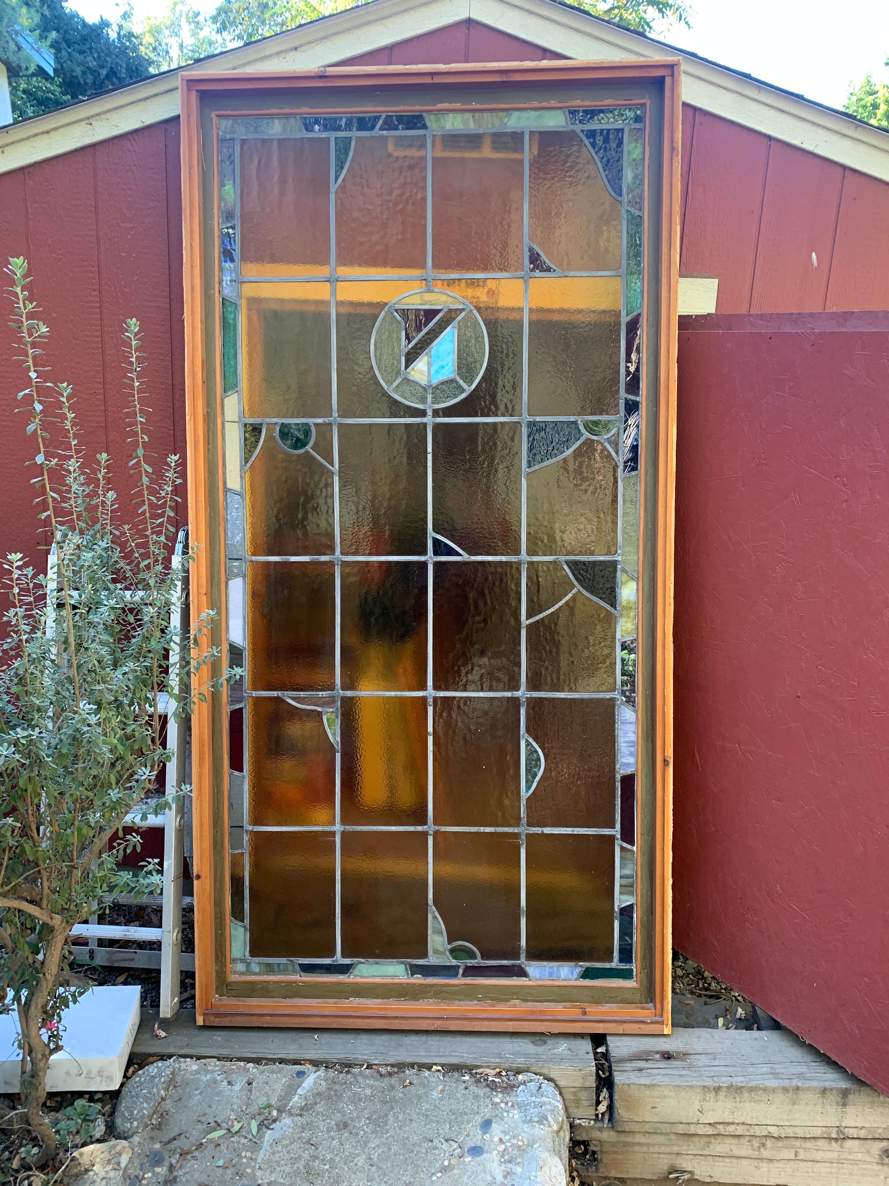 A monumental architectural element of stained glass. This stunning piece was removed from an Estate in the Hollywood Hills and has been kept in Tact with the framework. The glass is in excellent condition with no cracks, chips or structural issues.