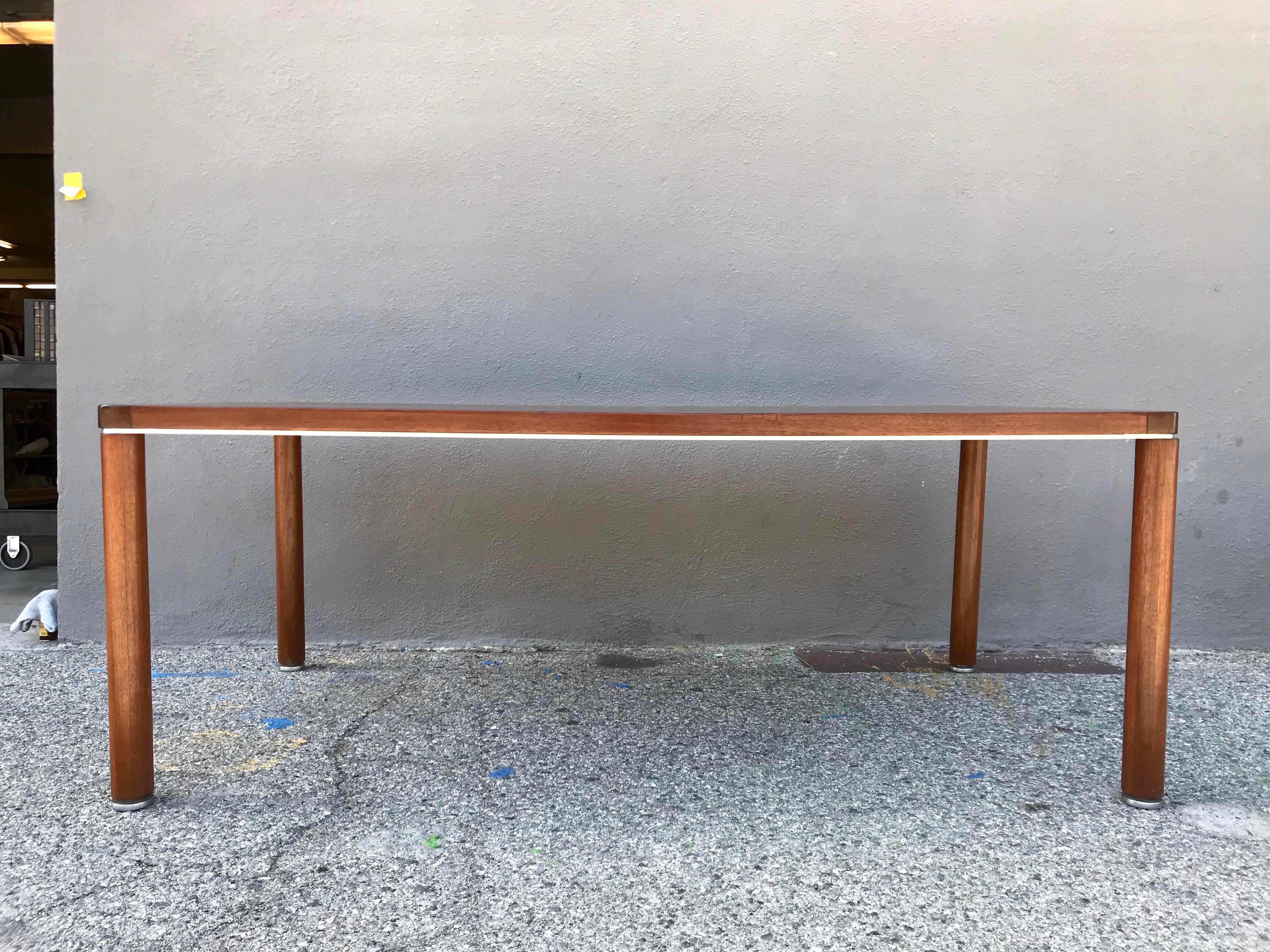 A nice work or dining table
walnut with rounded edges and metal band detailing
original vintage condition, patina, minor scuffs and scratches, no damage.