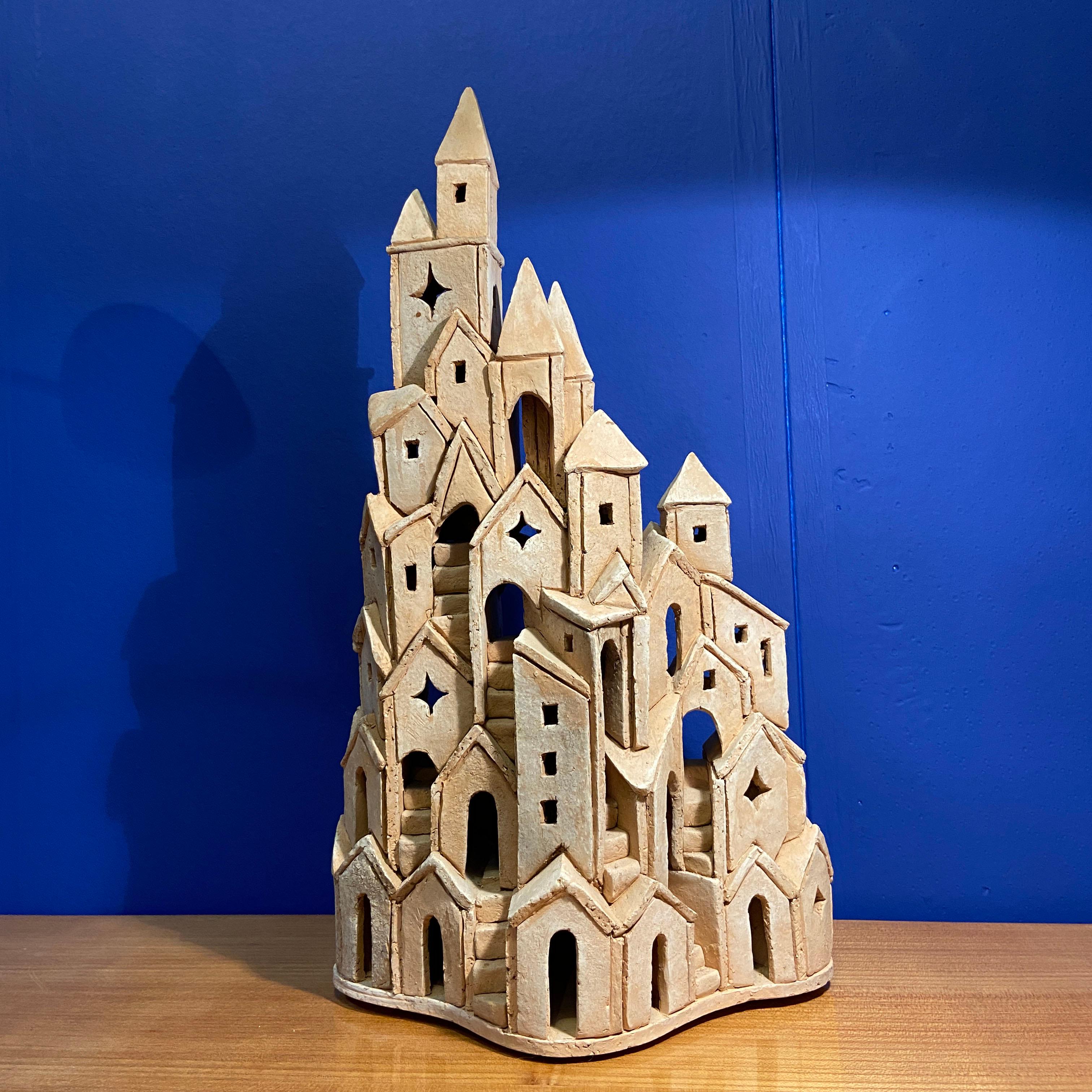Surrealist imaginary architectural tower build in red baking clay by Dutch artist Arie Bouter, Gouda 1995 (B. 1942) is carefully hand sculpted. The sculpture is based on medieval European architecture and has a strong resemblance with Mont St.