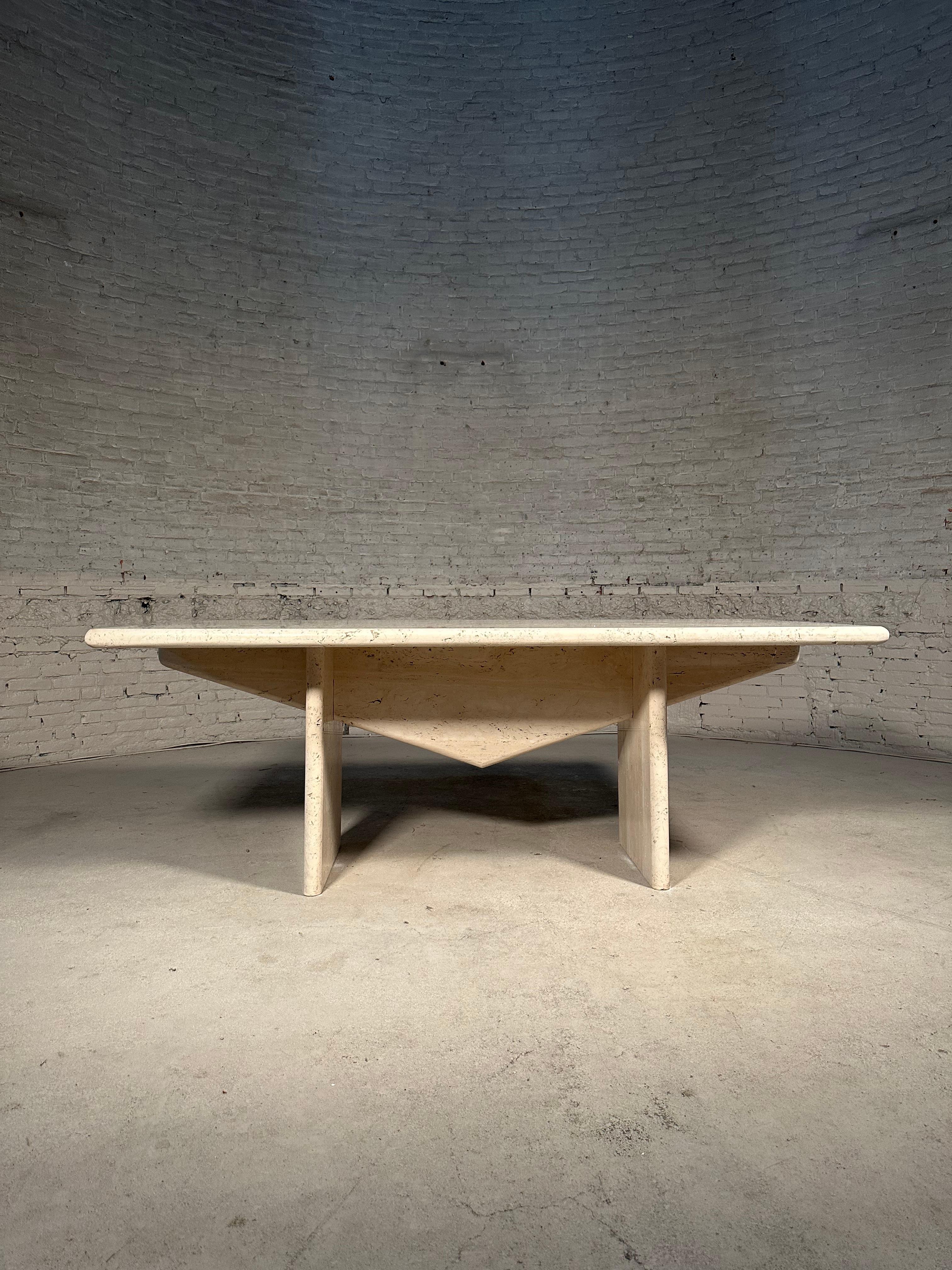 Expertly designed by the owner of a posh villa in Uccle, Brussels, this iconic Architectural Travertine Dining Table is a rare find.

With strong lines and 4cm thick travertine, this table exudes an arty and eclectic feel. Its 'brut' structure adds