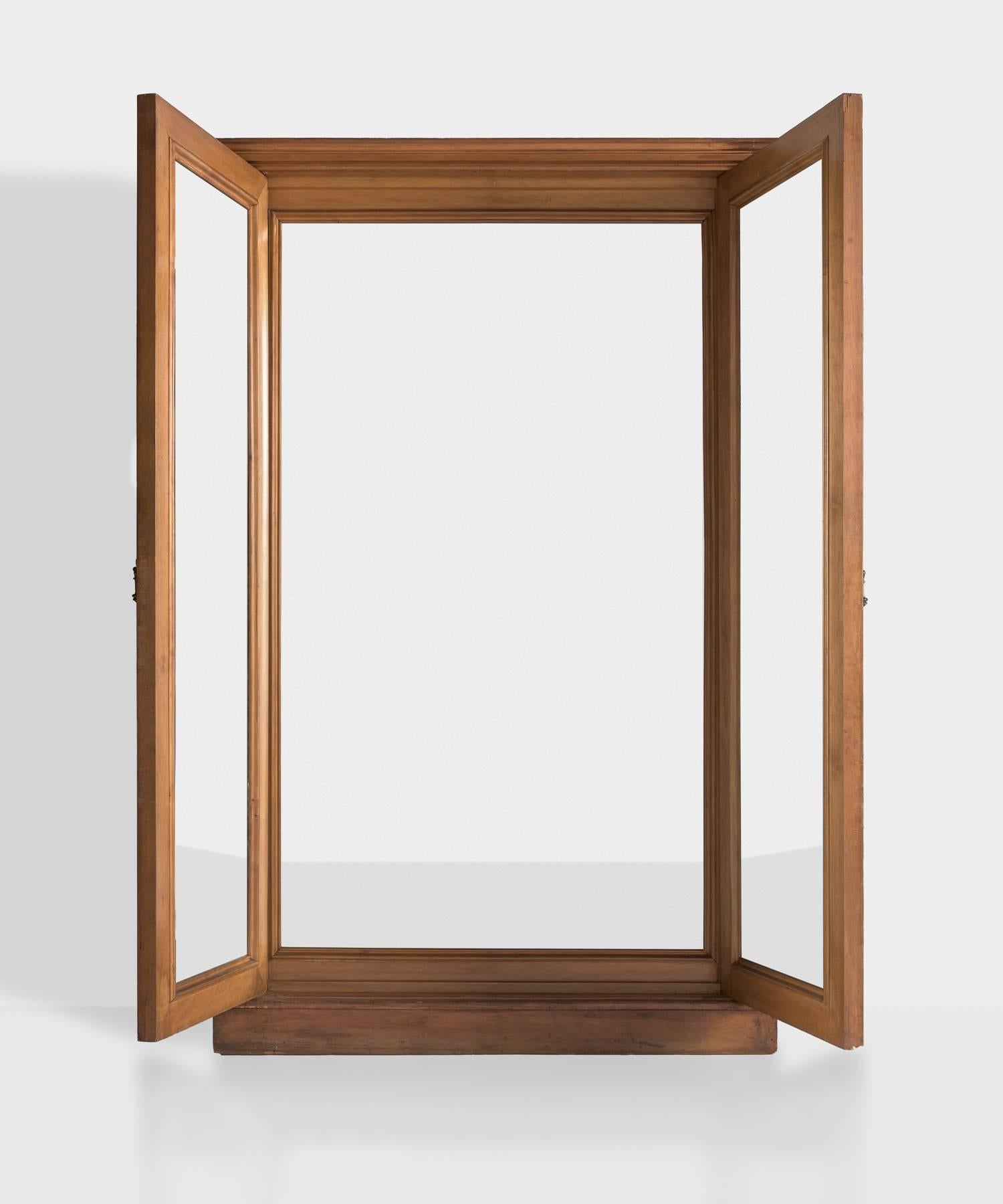 Architectural triptych mirror, circa 1870.

Full length dressing mirror with architectural design and bevelled glass interior.
