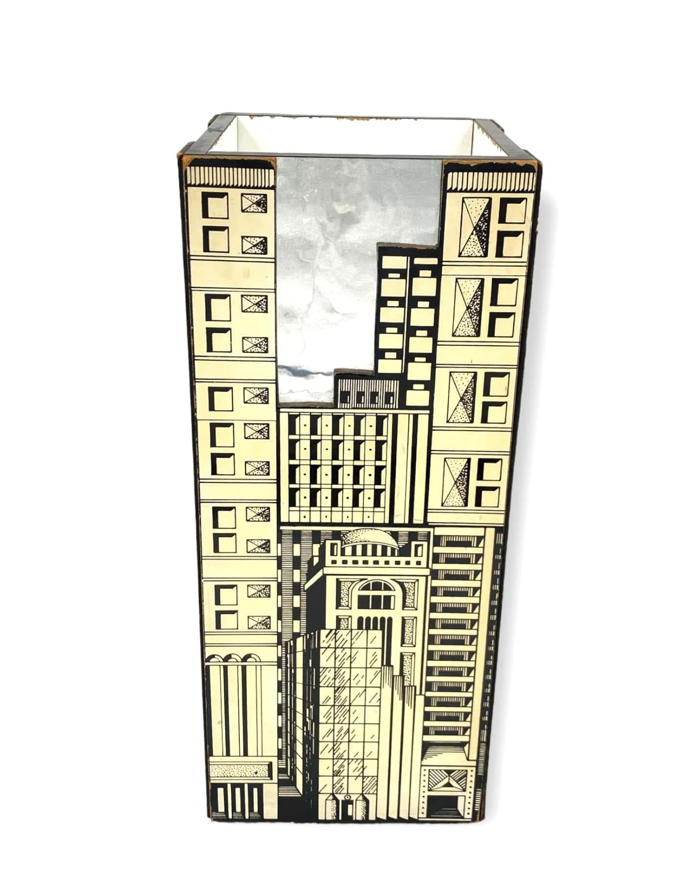 Architectural umbrella stand in the manner of Piero Fornasetti

Italy 1970s

Pressed wood, wood

Measure: H 51 cm

21 x 21 cm

Conditions: good consistent with age and use.