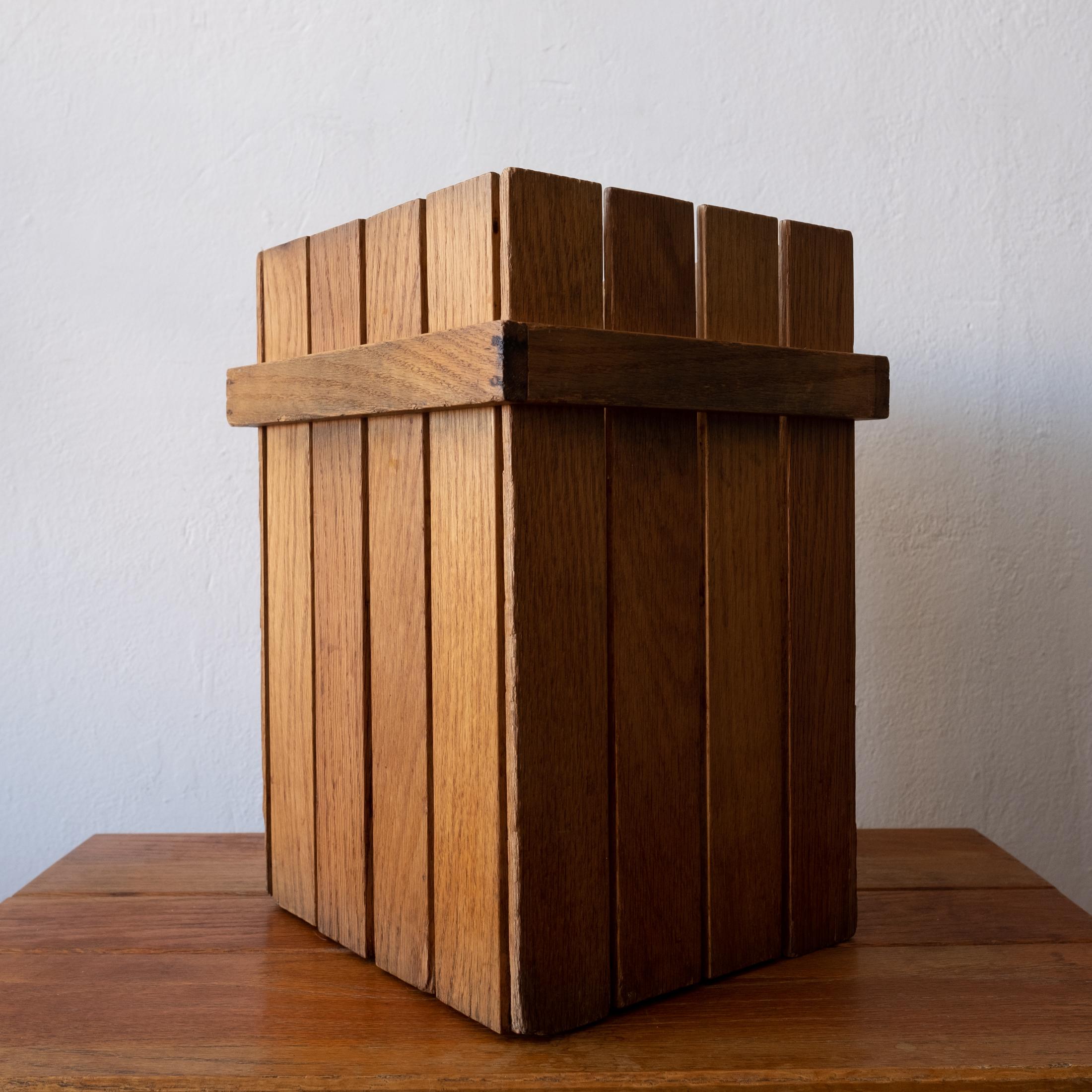 Handcrafted wood trash can from the mid century. Minimalist architectural design reminiscent of Frank Lloyd Wright. Sturdy construction.