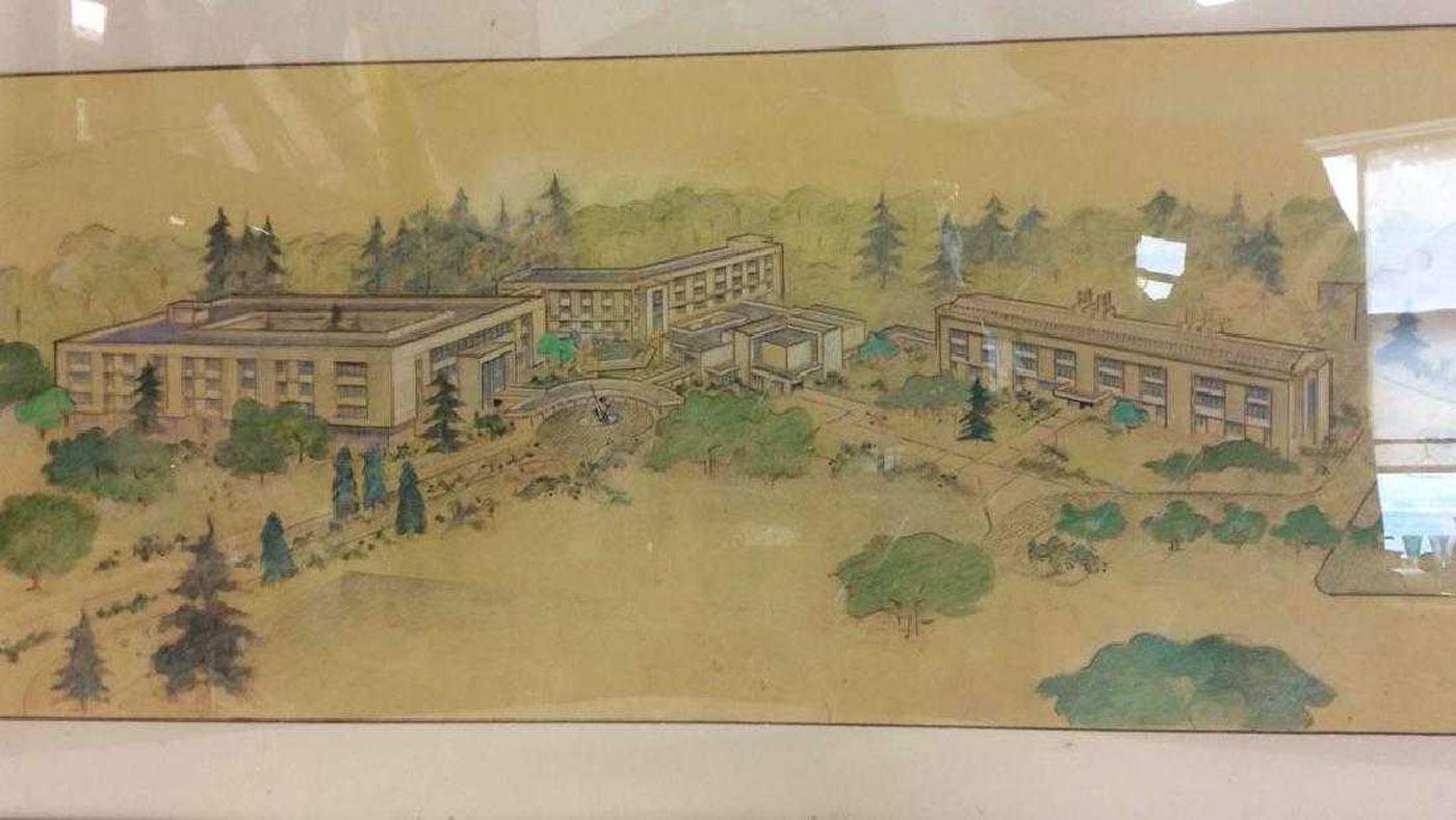Architectural landscape drawing. Top piece of paper has been cut into unique shape. Part of top paper has inch deep tear. Appears to depict a campus. Piece is professionally framed with black toned frame.