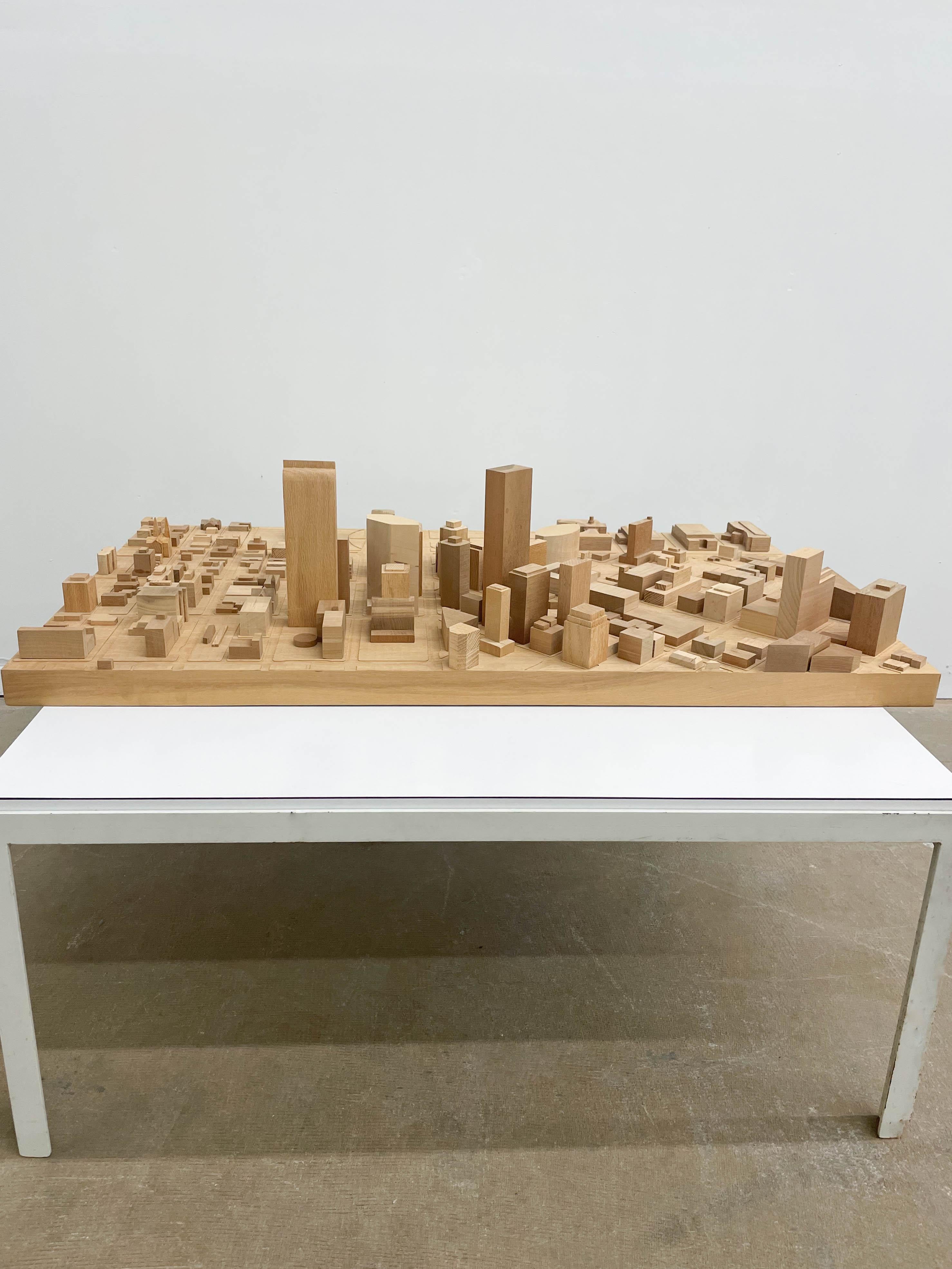 Beautiful architect’s model of downtown Denver, CO. in solid wood. Featuring a CNC base of streets and open spaces, individual buildings are modeled to scale in a variety of woods. Makes for an intriguing objet d’art when placed flat or hung on the