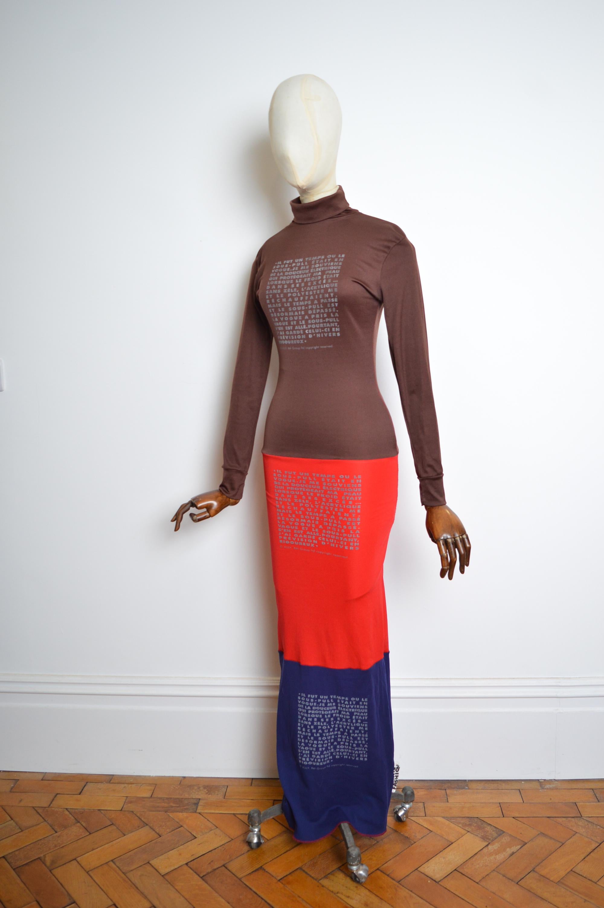 Archival 1990s Xuly Bët Recycled Polyester Avant Guard long Tec Dress 
Crafted from various recycled polyester jersey panels featuring printed poetry detailing and body contouring shape. 
High neck / long sleeves / funkin fashion factory. 
Pit to