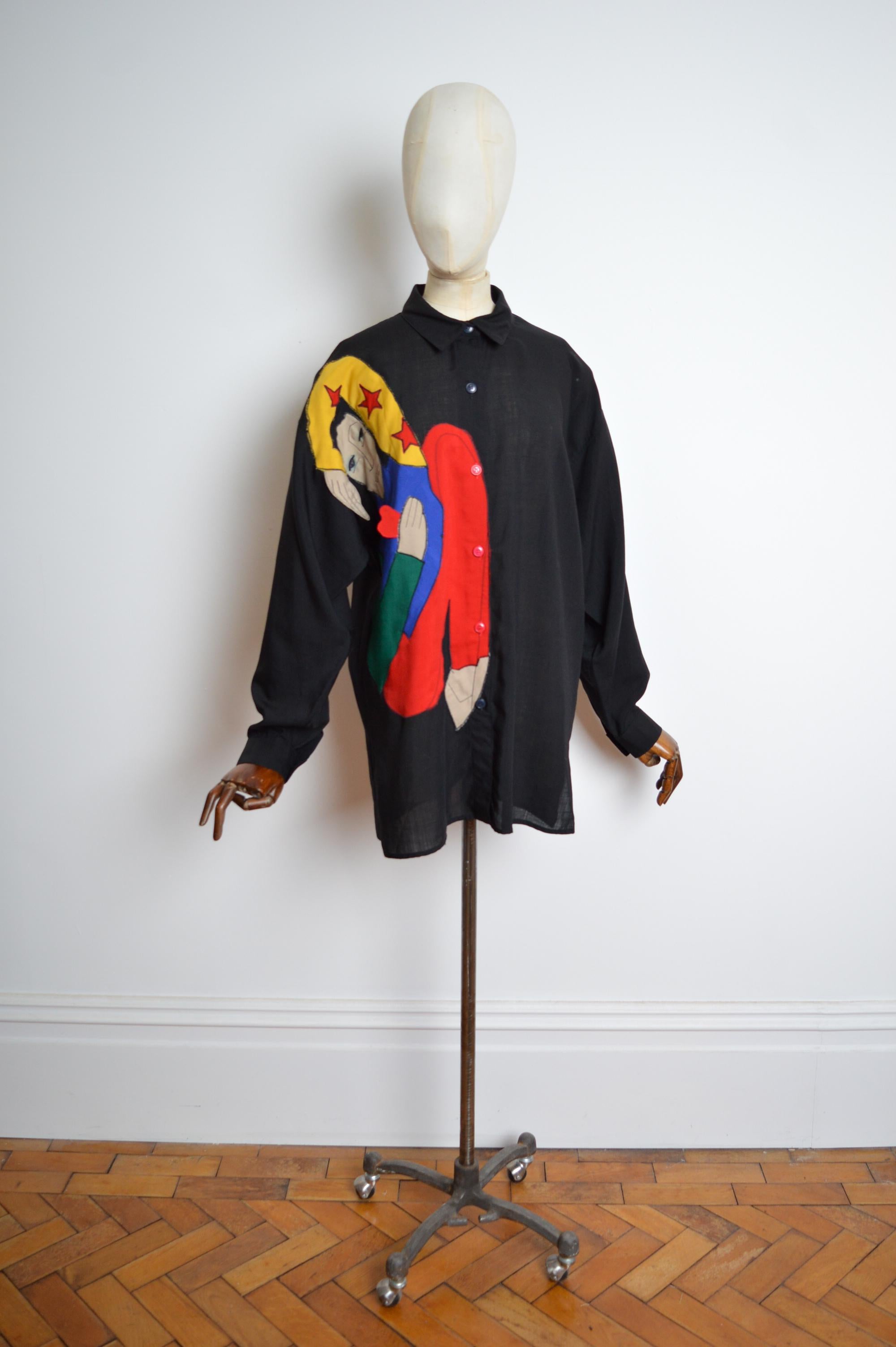 Archival JEAN CHARLES DE CASTELBAJAC Ko & Co Handmade Appliqué Artisan Shirt. 
Superb hand sewn piece by French artist and Designer JCDC ! 
Buttons down front / Long sleeves / superb applique artwork detail / Hand Written label. 
Pit to Pit;