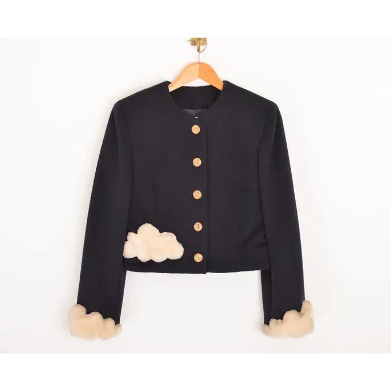Vintage 1990s Moschino 'Cheap & Chic' black Wool & faux fur suit. Featuring 'Heads in the clouds' embroidery in gold on the back of the jacket.
Extremely rare. 

Features:
Central line Moschino Cheap & Chic embossed button fasten
'Head in the