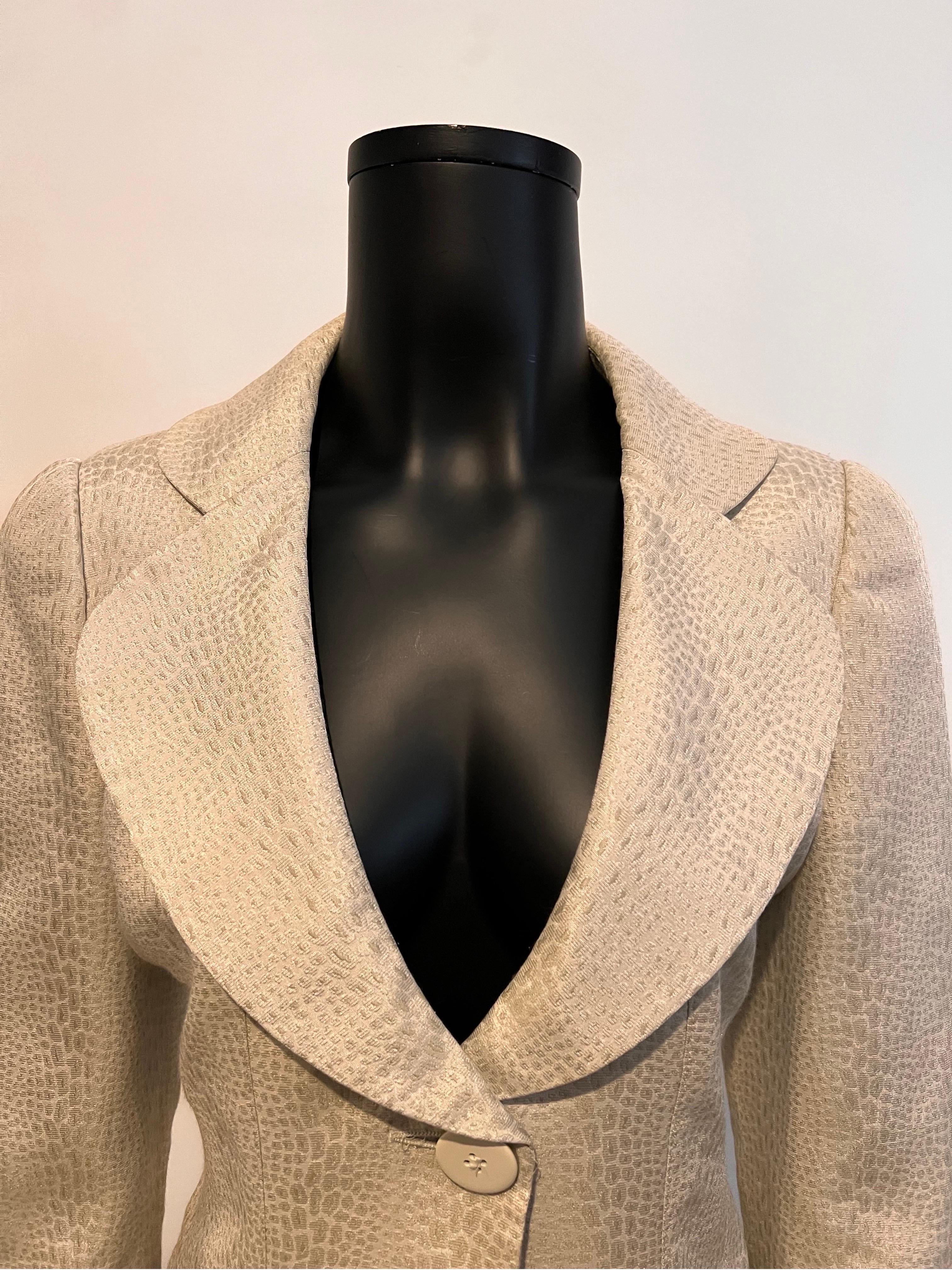 An archive 2007 vintage Armani Collezioni cropped evening jacket in a beautiful reptile/python style embossed fabric with one button and soft gathered detail on the lower part of the garment.

Oversized rounded lapel and collar with set in rounded