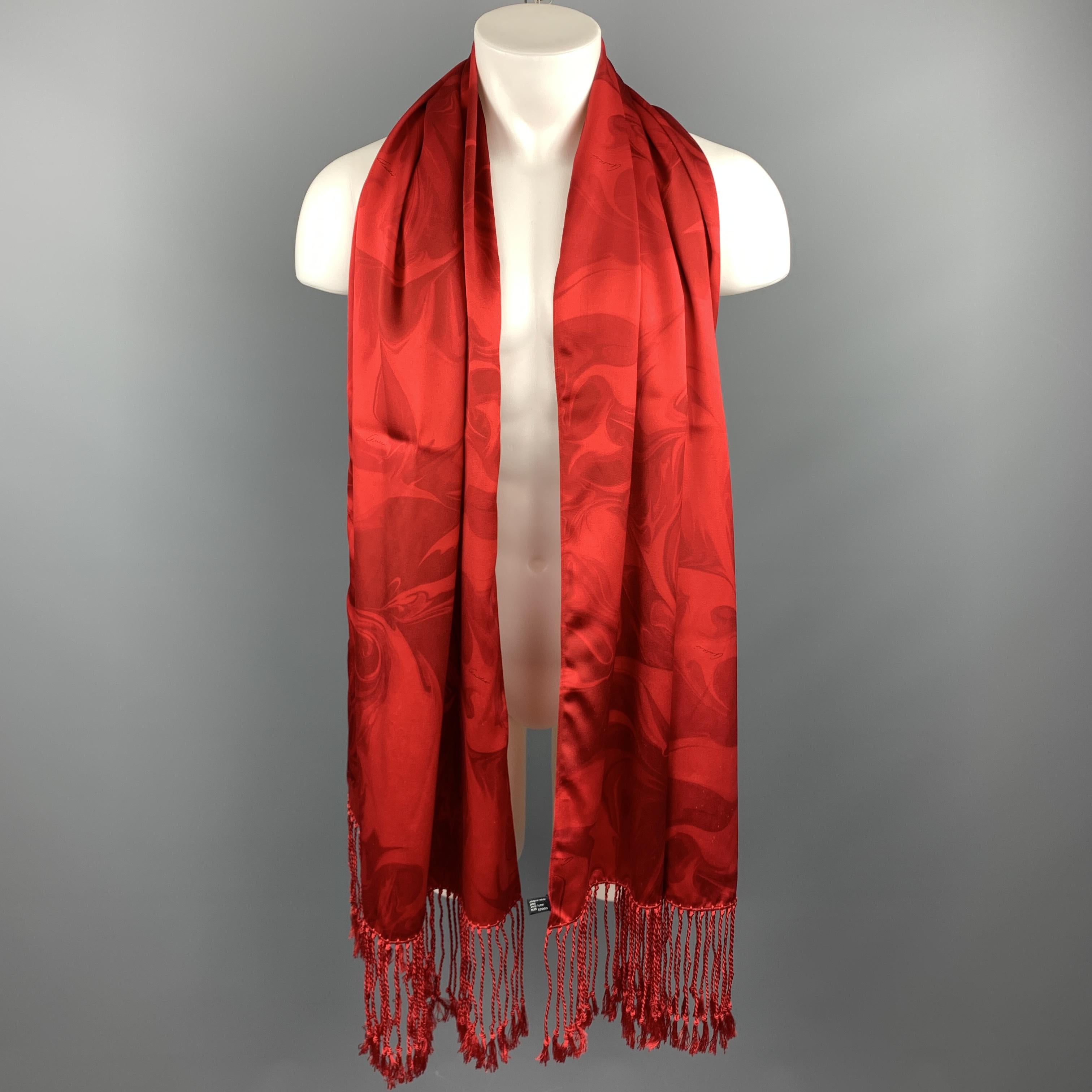 Archive GUCCI by TOM FORD scarf comes in a red smoked marbled print with a seven inch tassel fringe trim. Minor fabric peel throughout. Made in Italy.

Very Good Pre-Owned Condition.

Measurements:

25.5 in. x 76 in.