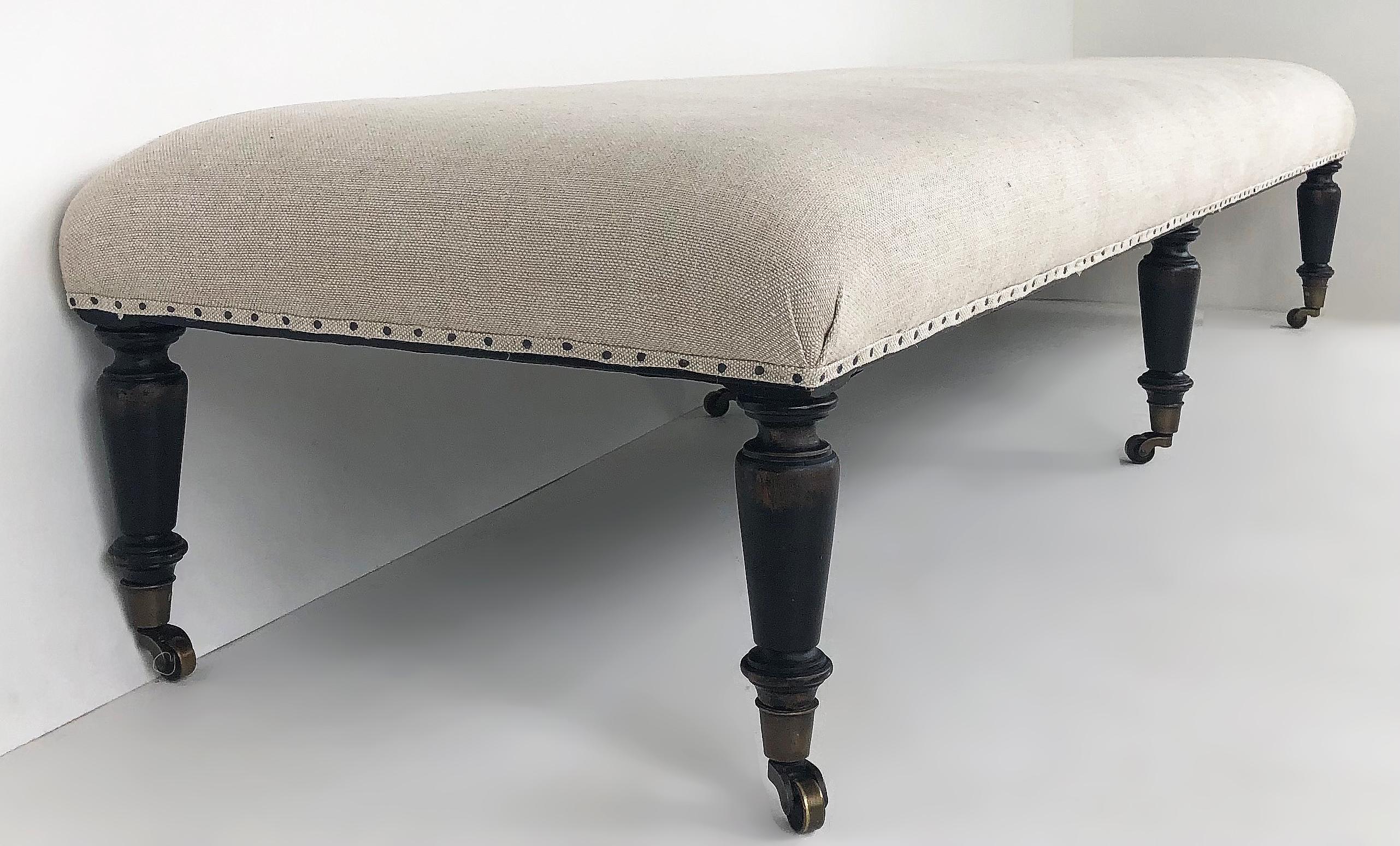 British Colonial Archive Home for Century Linen Bench with Turned, Tapering Feet on Brass Casters