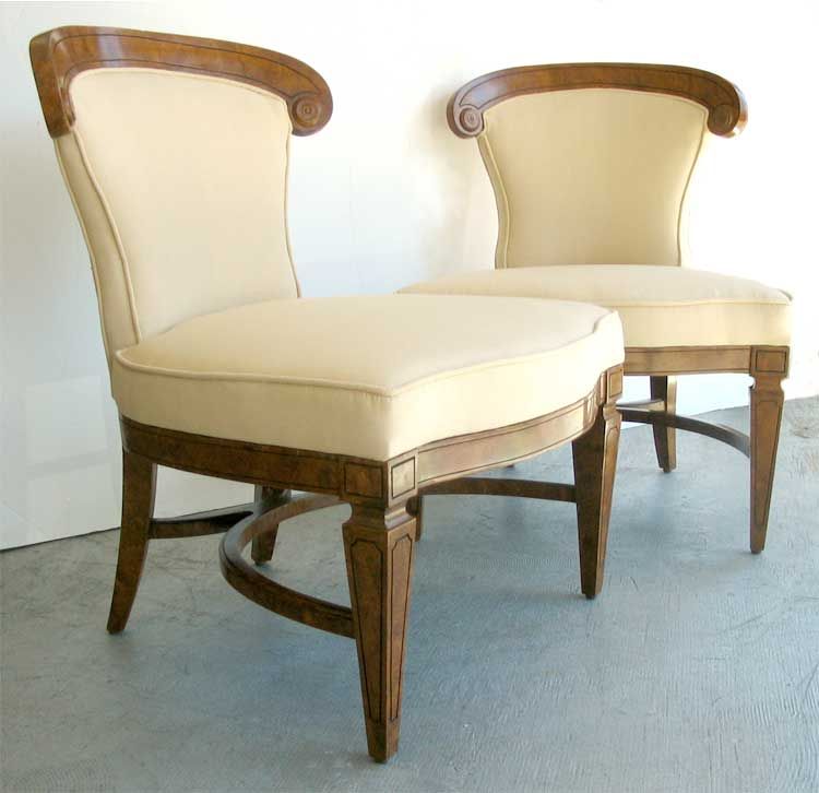 Pair of mid century low "chauffeuses" chairs.