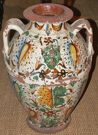 Late 19th-Early 20th Century Italian Majolica Olive Oil Storage Jar in the Renaissance Manner.  The front painted with stylized floral and fauna.