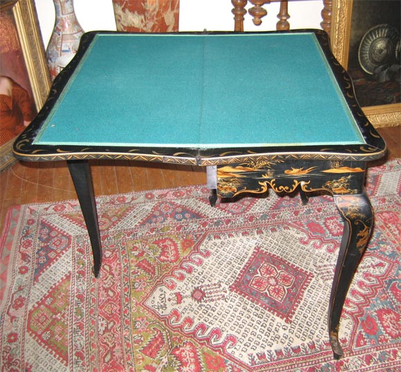Game table with lacquered Chinese style scenes.
