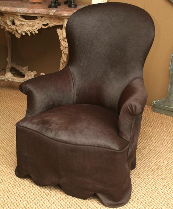 Dramatic balloon shaped curving back terminatin in small gathered scroll arms hand tied spring seat with extenuating scalloped skirt beautiful upholstered in mocha pony hair