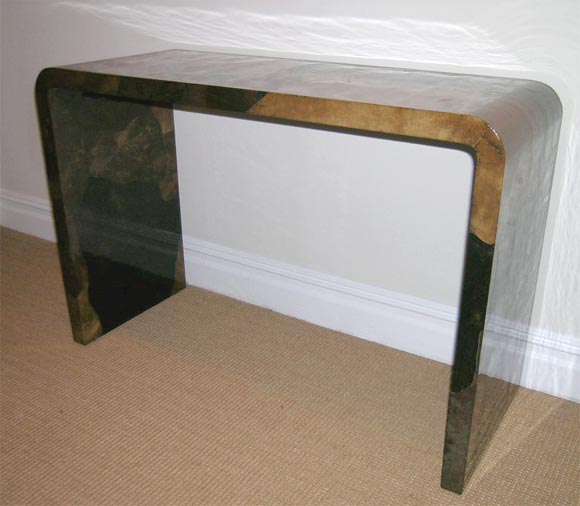 A Karl Springer Brown Parchment Waterfall Console.