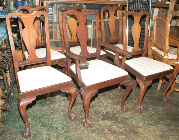 Set of 6 Centennial Dining chairs comprising 1 arm chair and 5 side chairs.  In the Chippendale style with baluster sahpe back splat and claw and ball feet.  American, Circa 1890.
