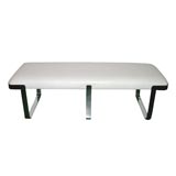 Chrome bench upholstered in white leather