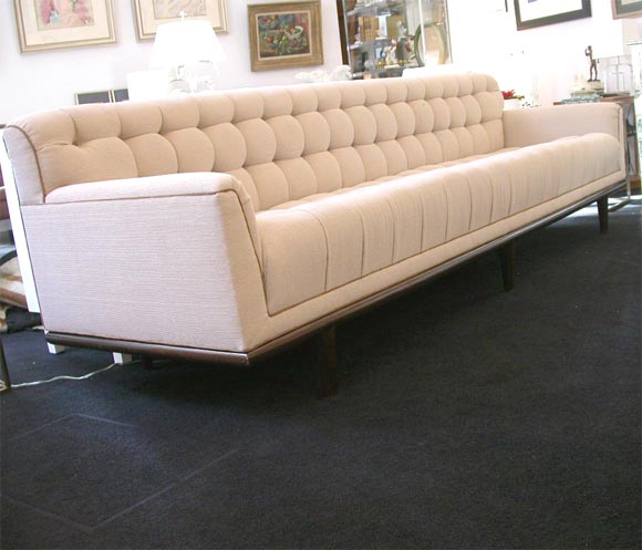 Biscuit-tufted Mid-Century Sofa in ivory with cocoa ultrasuede piping and button detail.  Newly reupholstered and restored.