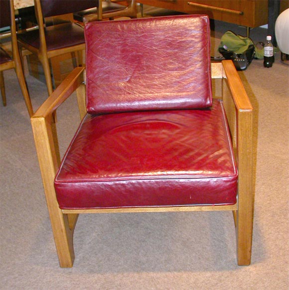Pair of open-arm mahogany lounge chairs by Harvey Probber
