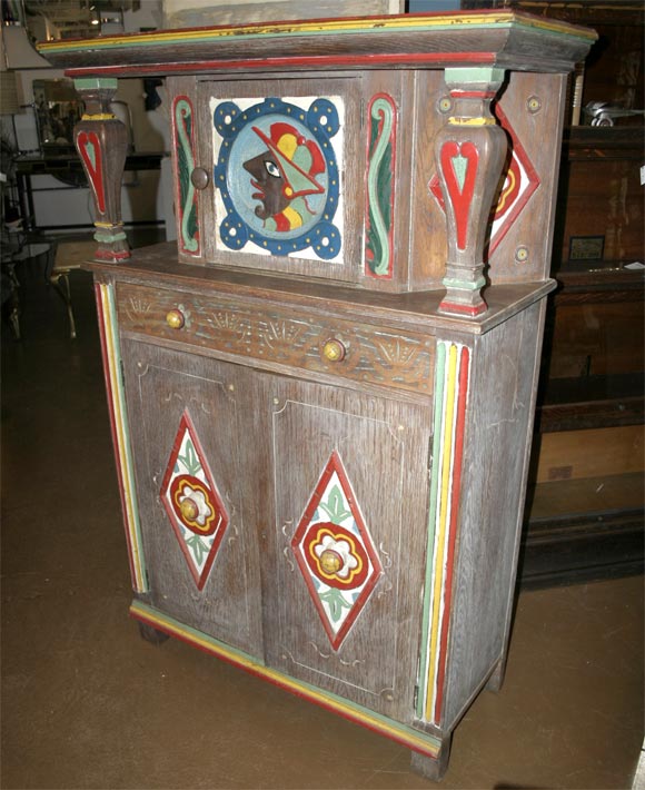 Very unusual oak carved and painted cabinet,possibly California Mission inspired.