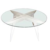 A lacquered glass topped cocktail table by Gio Ponti