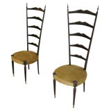 A wonderful pair of stylized ladder back chairs