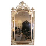 A paint and gilt wall mirror from Provence