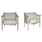 Pair of finely carved low armchairs