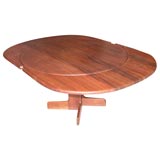 Solid sedua wood dining table w/leaves by Gerald McCabe